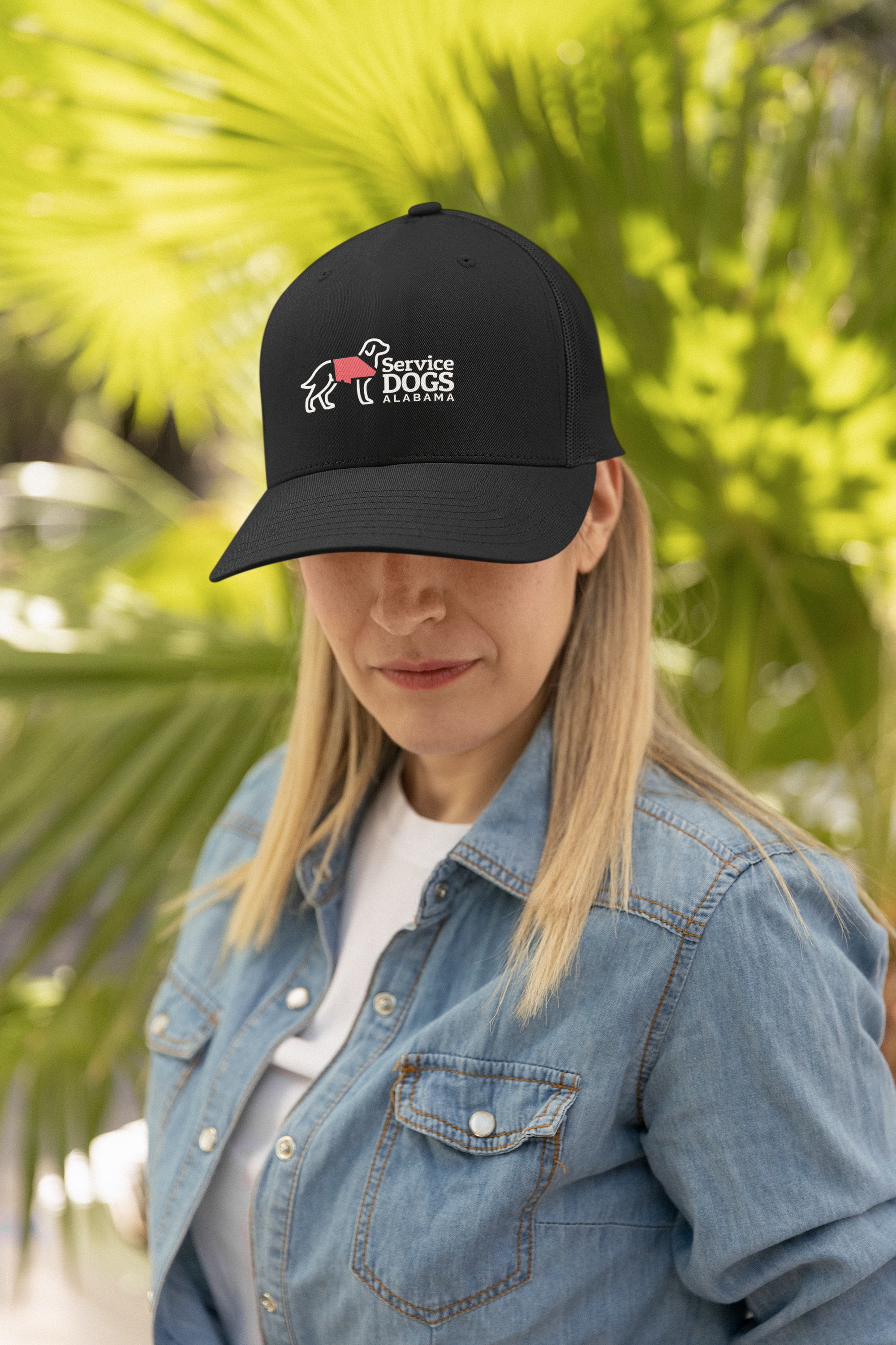 yupoong-trucker-hat-mockup-featuring-a-woman-with-a-denim-jacket-m34838.png