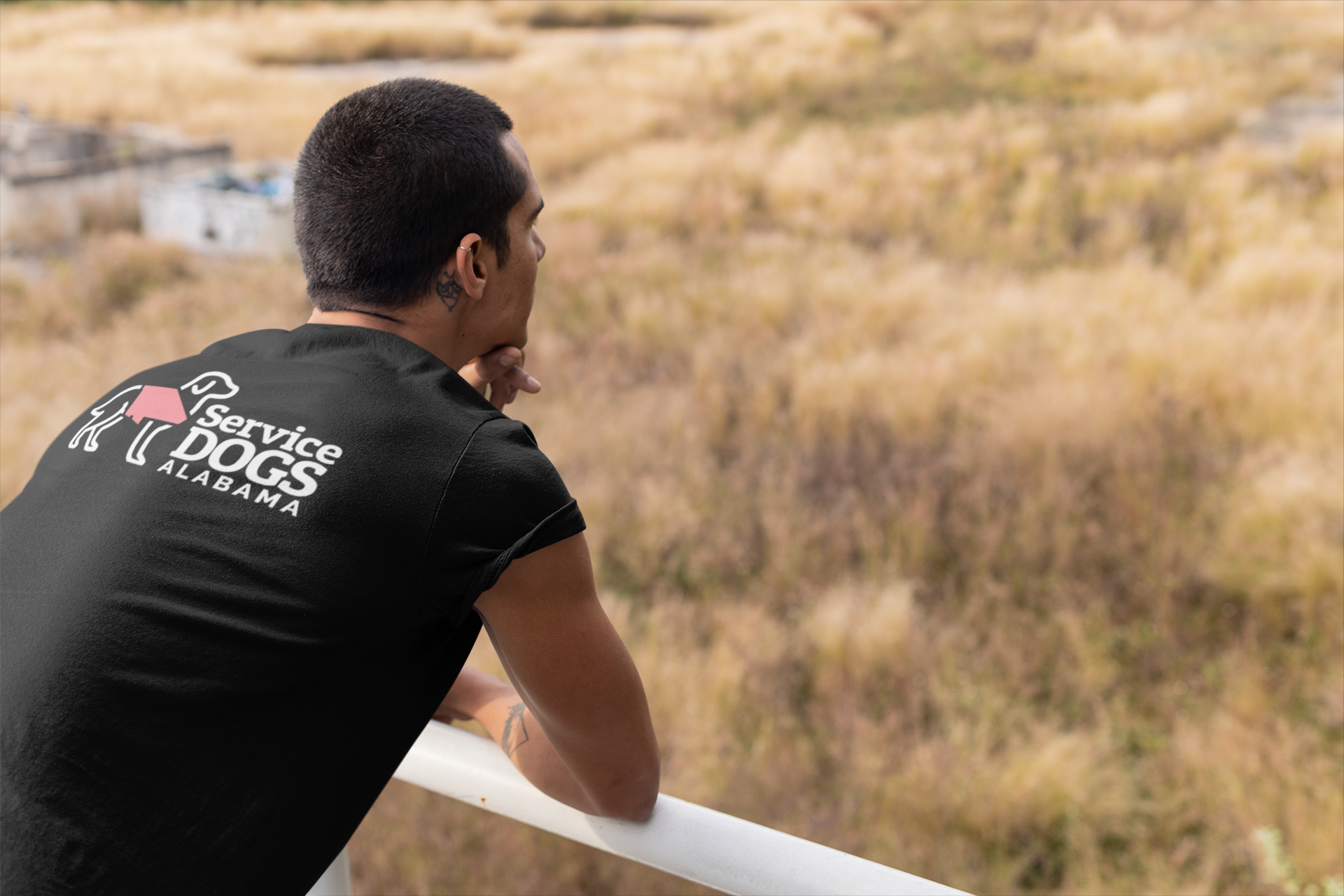 back-view-mockup-of-a-man-wearing-a-t-shirt-looking-to-the-horizon-outdoors-24529.png