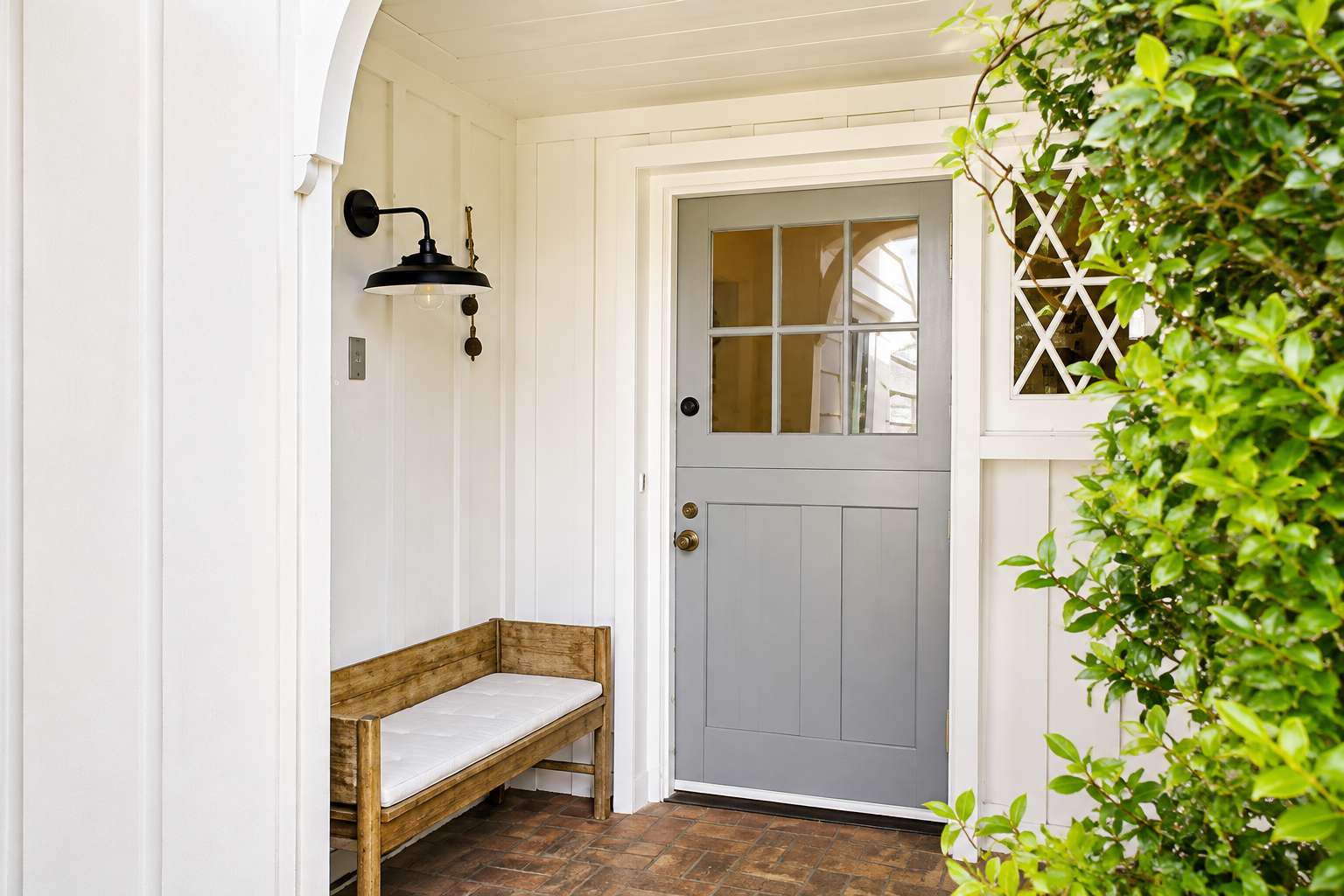 a_bright_clean_exterior_front_side_porch_entryway.png