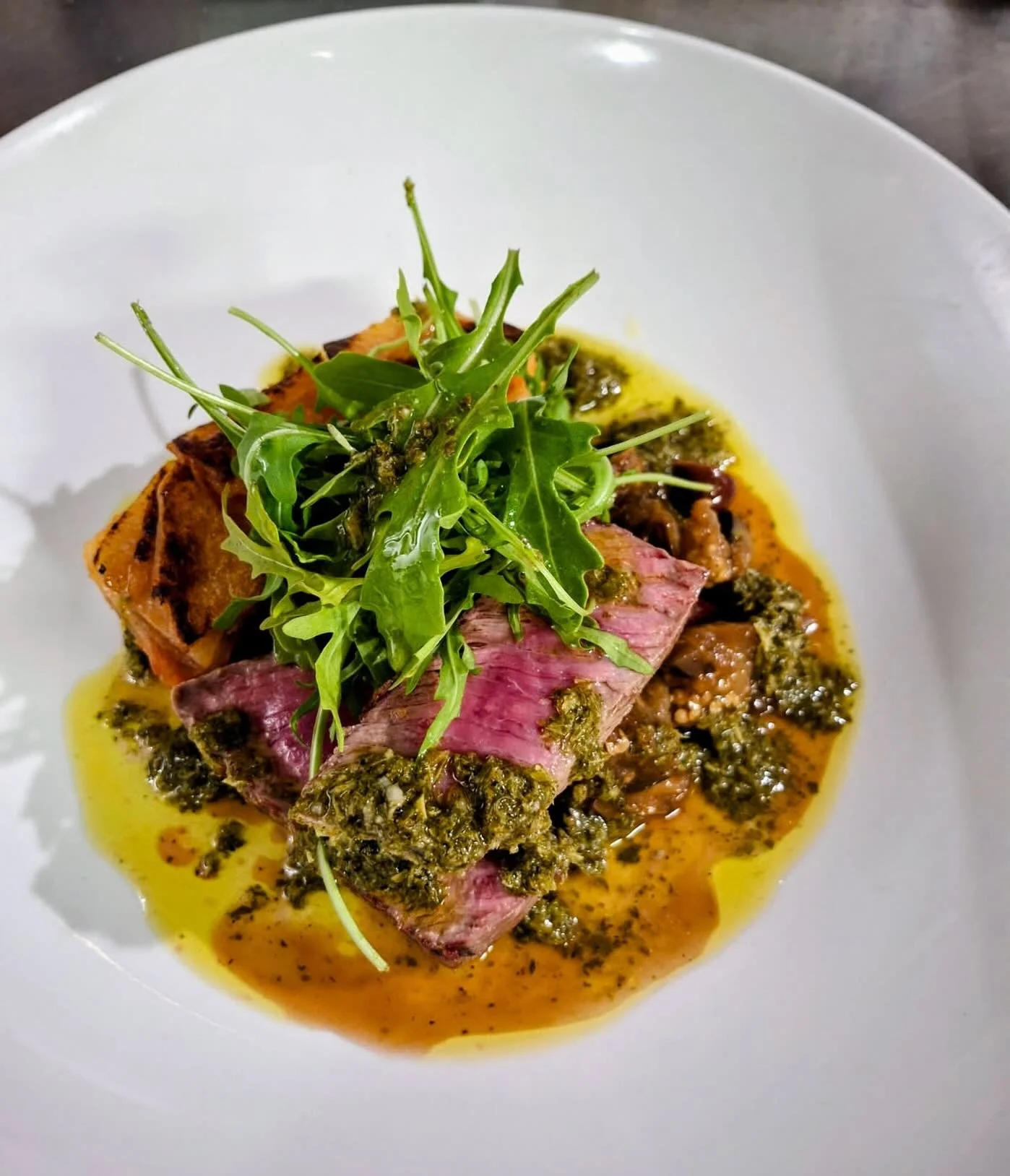 Barchetta special - @millyhillmeat lamb loin served with salmoriglio, tomato and onion braised potatoes, eggplant, and black olive agridolce.
A beautiful balance of rich, savoury flavours &mdash; best enjoyed with a glass of red 🍷

#BarchettaPadding