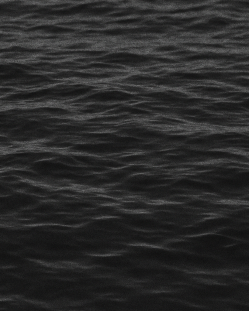 ocean water with waves in black and white