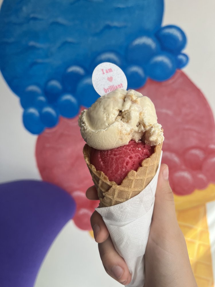 Two scoops of ice cream in a waffle cone