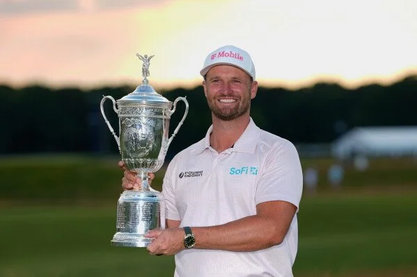 Wyndham Clark holds the U.S. Open trophy on Sunday, June 21, 2026 after winning the championship.