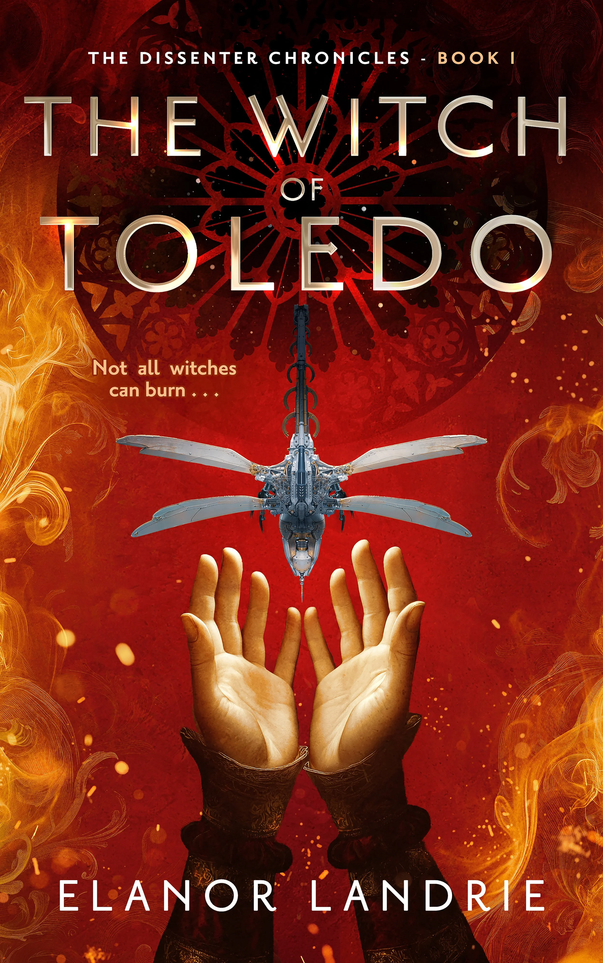 Book cover: The Witch of Toledo. A woman's hands reach up to receive a small insect-shaped robot. Flames burn all around, and a cathedral rose window with stars inside glows in the background. Tagline reads: Not all witches can burn.