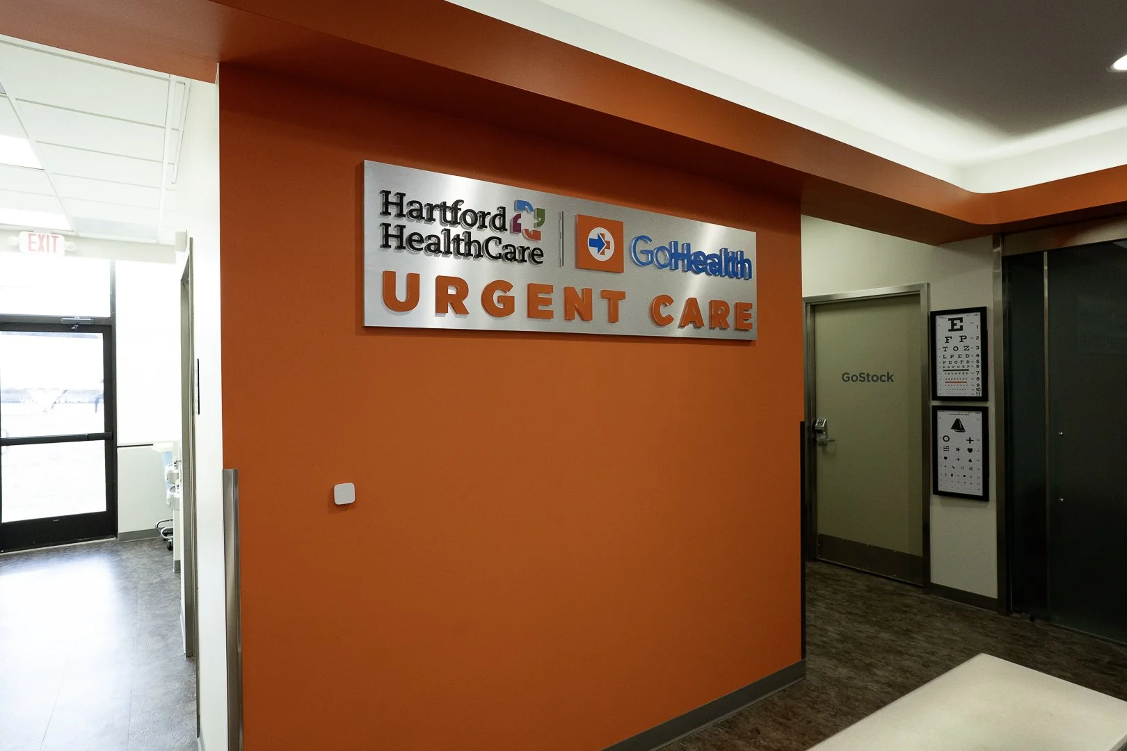 Sign for Hartford Healthcare GoHealth Urgent Care in a medical facility.