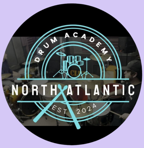 Logo for North Atlantic Drumming Academy, established 2024, featuring a drum set with drumsticks crossing in front. Bold Note Vocal Coaching, Bideford. Singing Lessons in Bideford. North Atlantic Drum Academy. Drum Lessons Bideford.