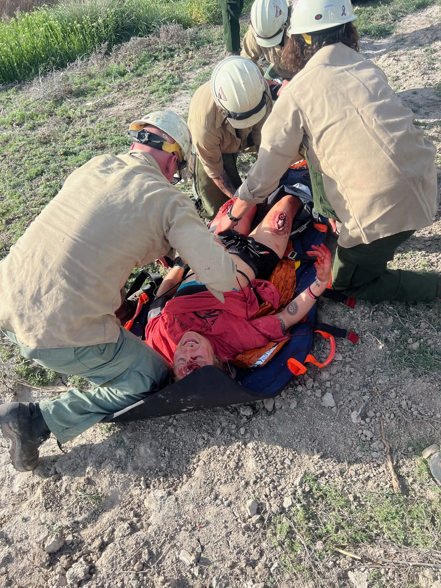 Team assessing trauma on a student patient