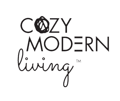 Text saying 'COZY MODERN living' with a crossed-out circle over the letter 'O' in 'COZY'.