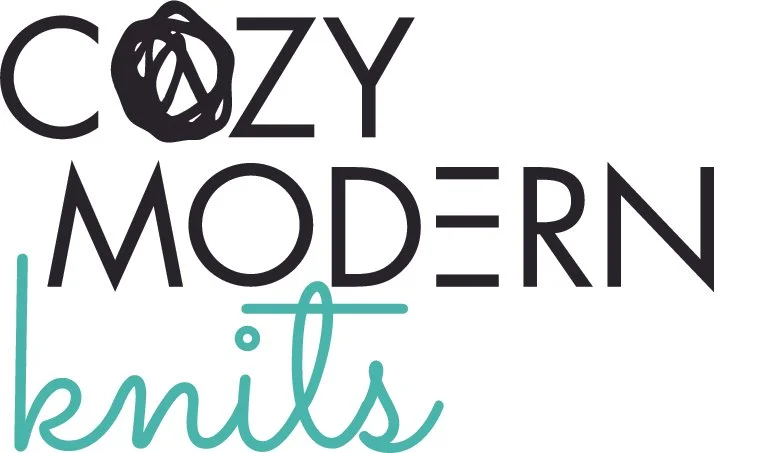 Logo with the words 'Cozy Modern Knits' in stylized fonts, with a black yarn ball replacing the 'o' in 'Cozy'.