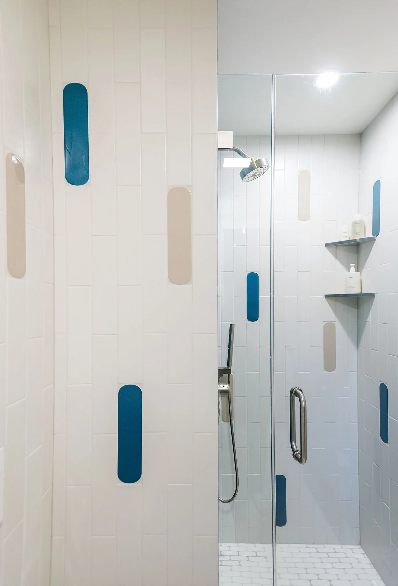 Modern mix of solid color and white tiles in cozy home spa.