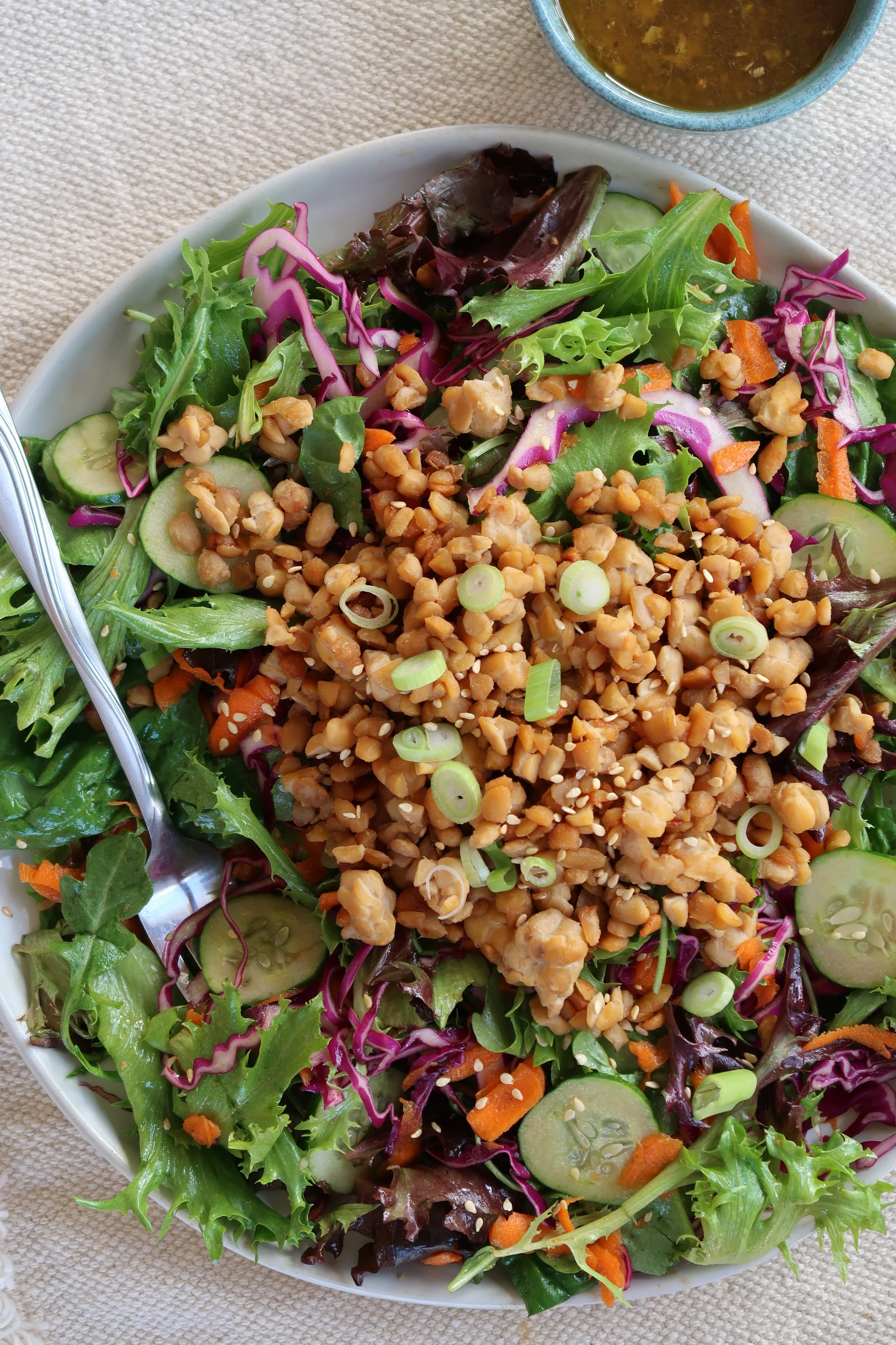 asian-style mixed greens salad with tempeh