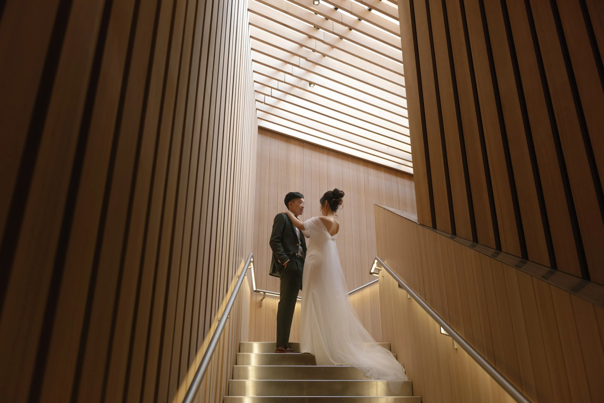 bride and groom at the audain art museum in whistler, british columbia