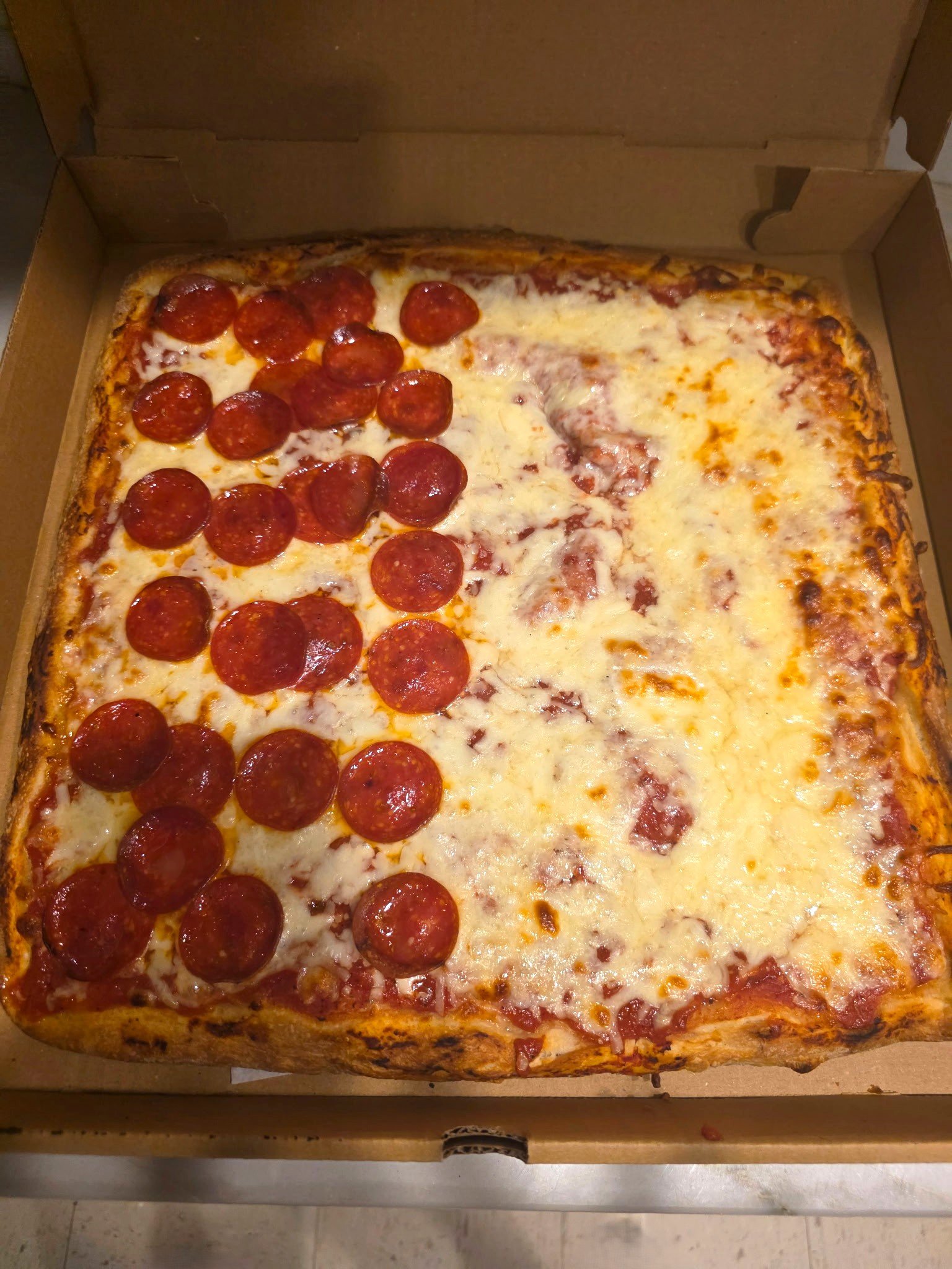 Sicilian Pie customized with half cheese and half pepperoni