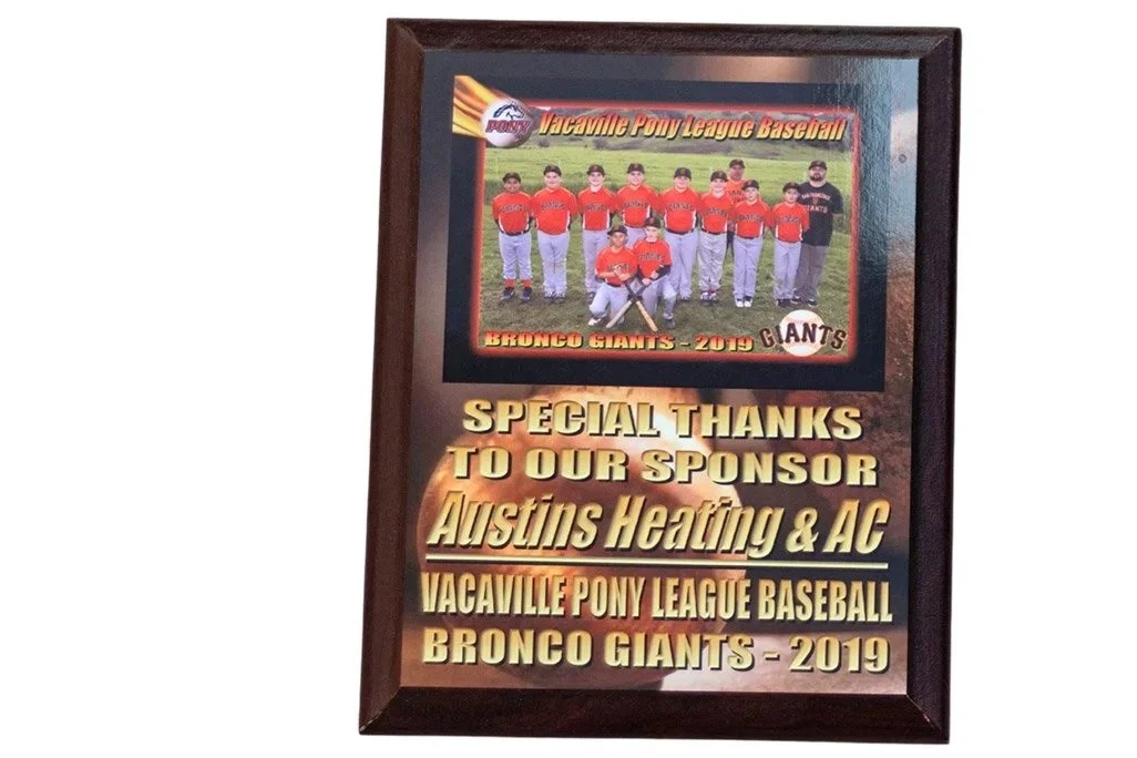 Framed plaque commemorating the 2019 Vacaville Pony League Baseball team, the Broncos Giants, with a team photo and sponsor acknowledgment from Austins Heating & AC.