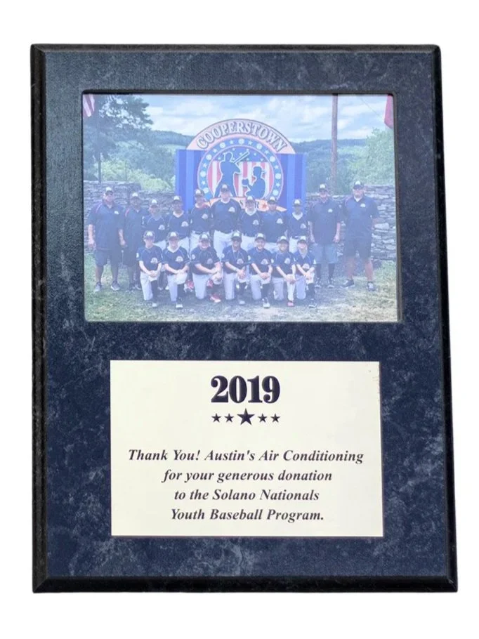 Plaque with photo of a youth baseball team and a thank you message to Austin's Air Conditioning for their donation to the Solano Nationals Youth Baseball Program.