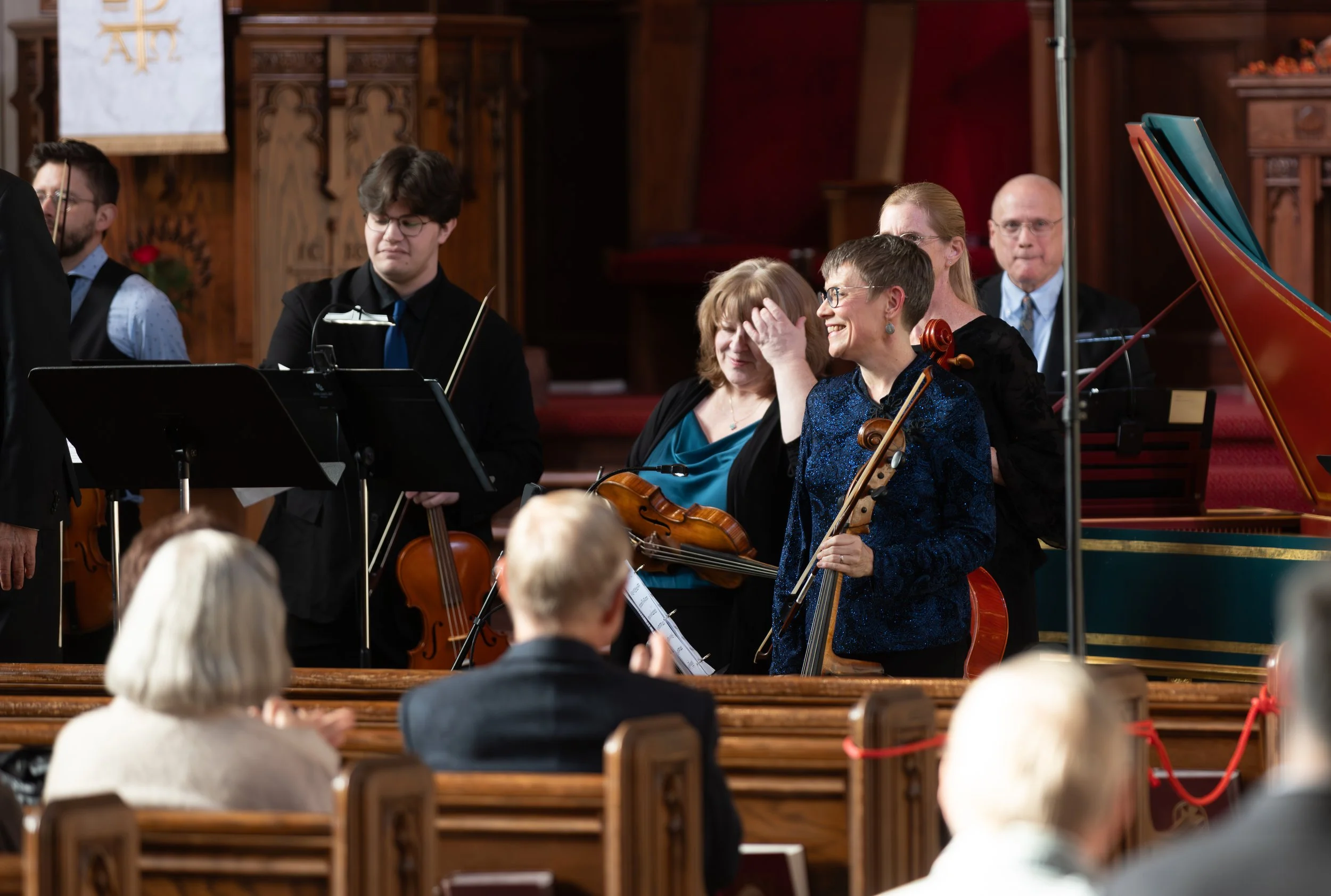 String platers smile before a concert
