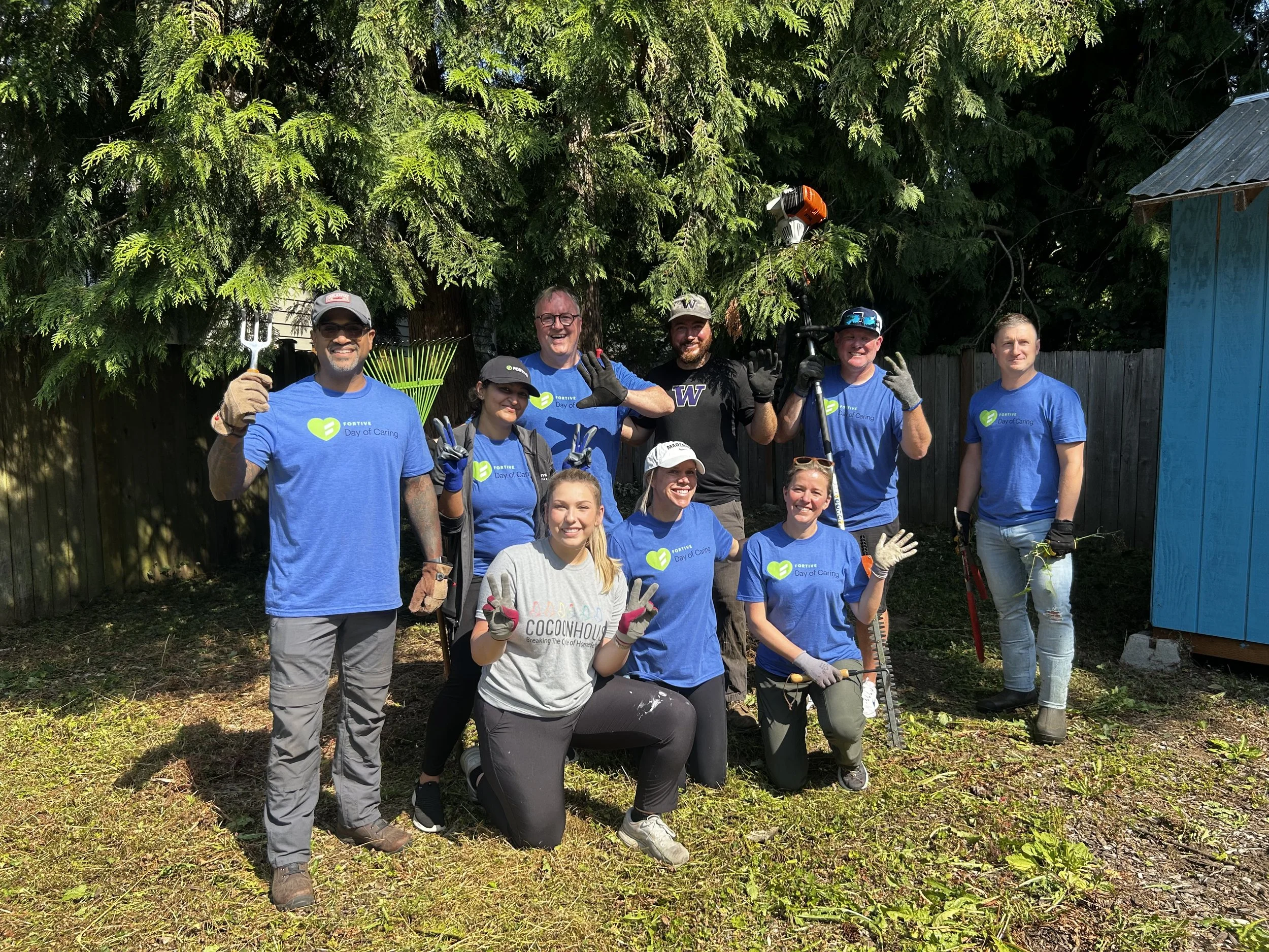 Volunteers cleaning and improving outdoor space in Snohomish County, supporting youth programs through community service
