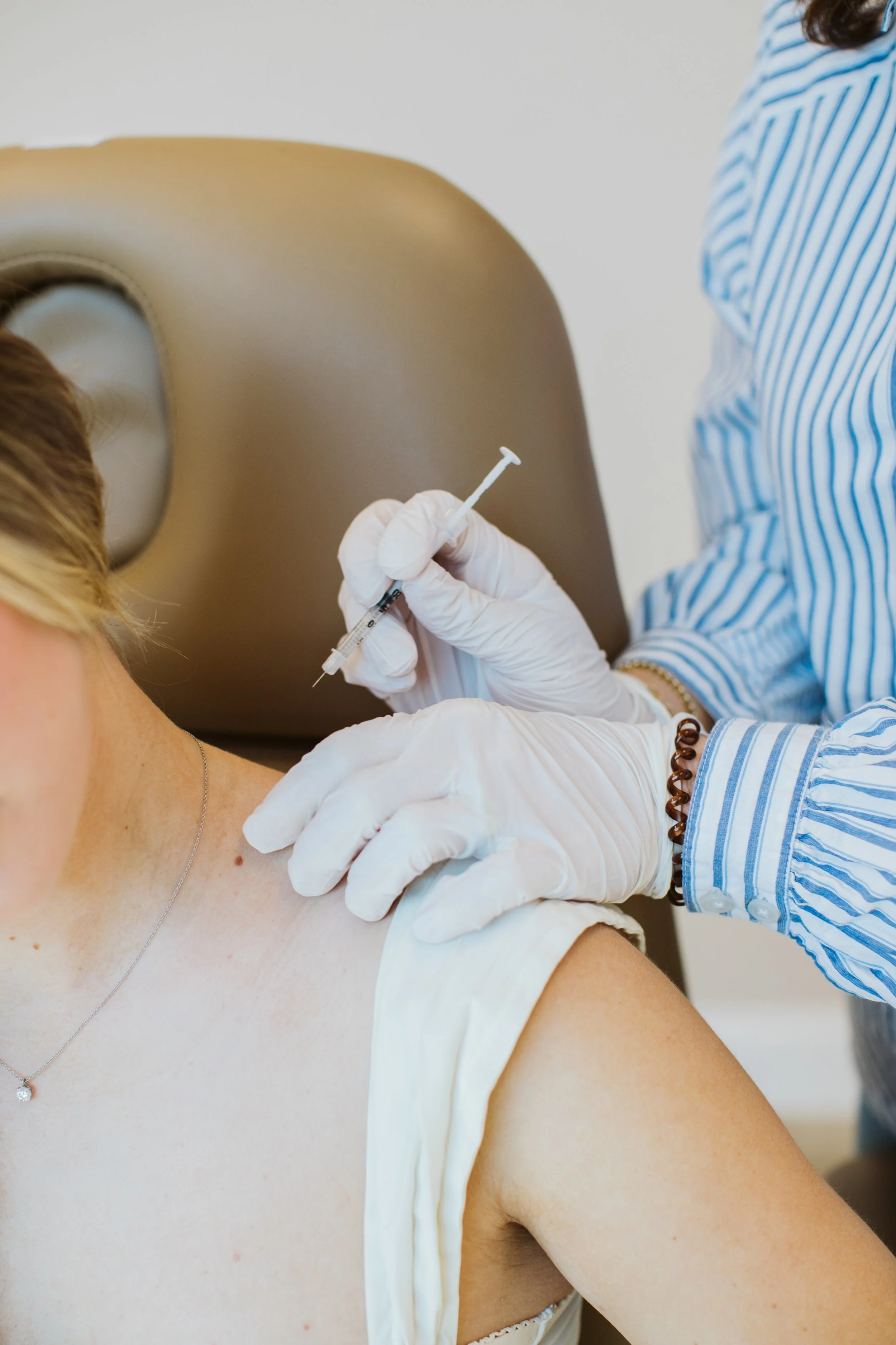  Branding photography showcasing a Dew Skincare product with natural light and minimal styling for a clean, self-care aesthetic. 