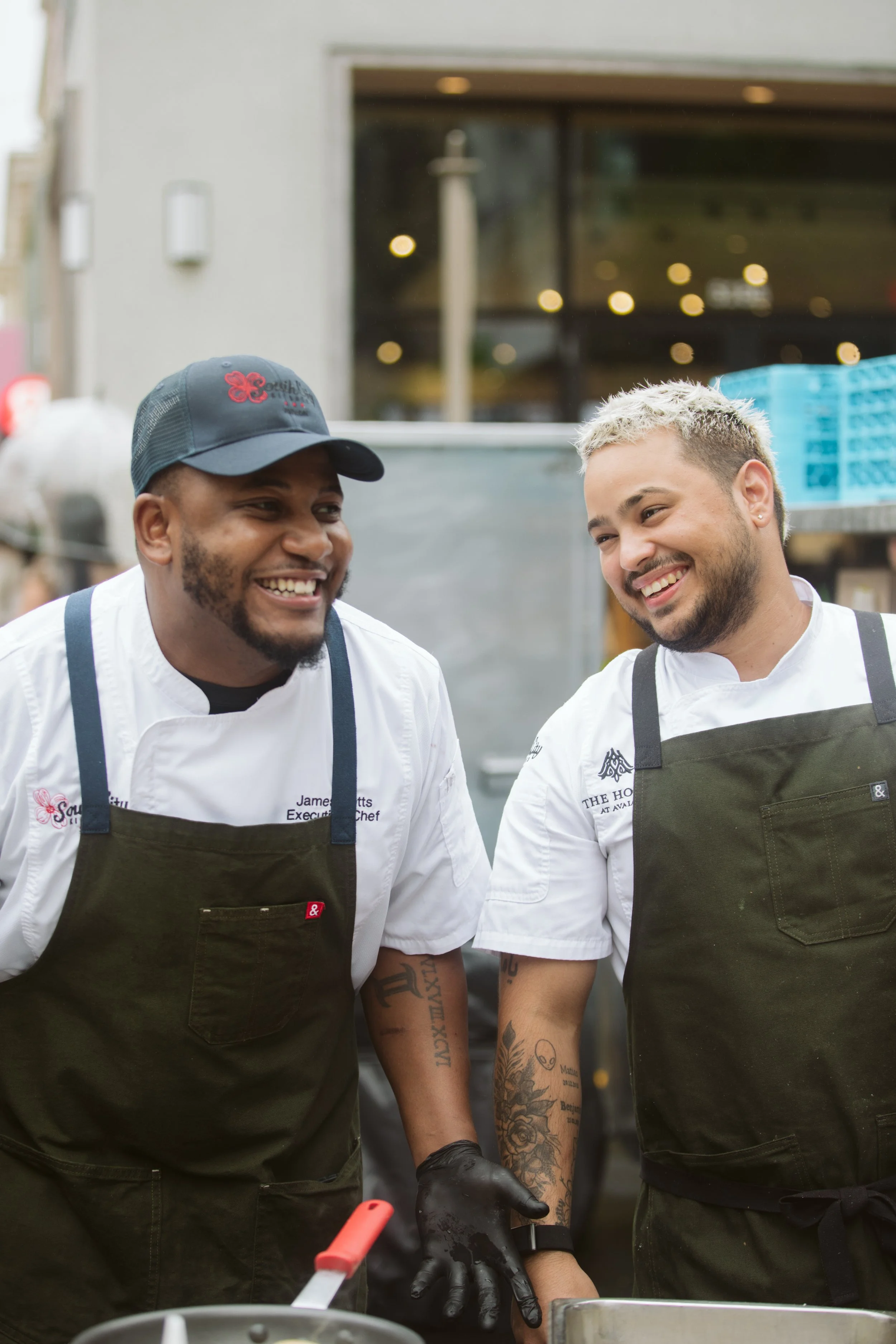 Restaurant vendors showcasing dishes at Savor the Boulevard at Avalon