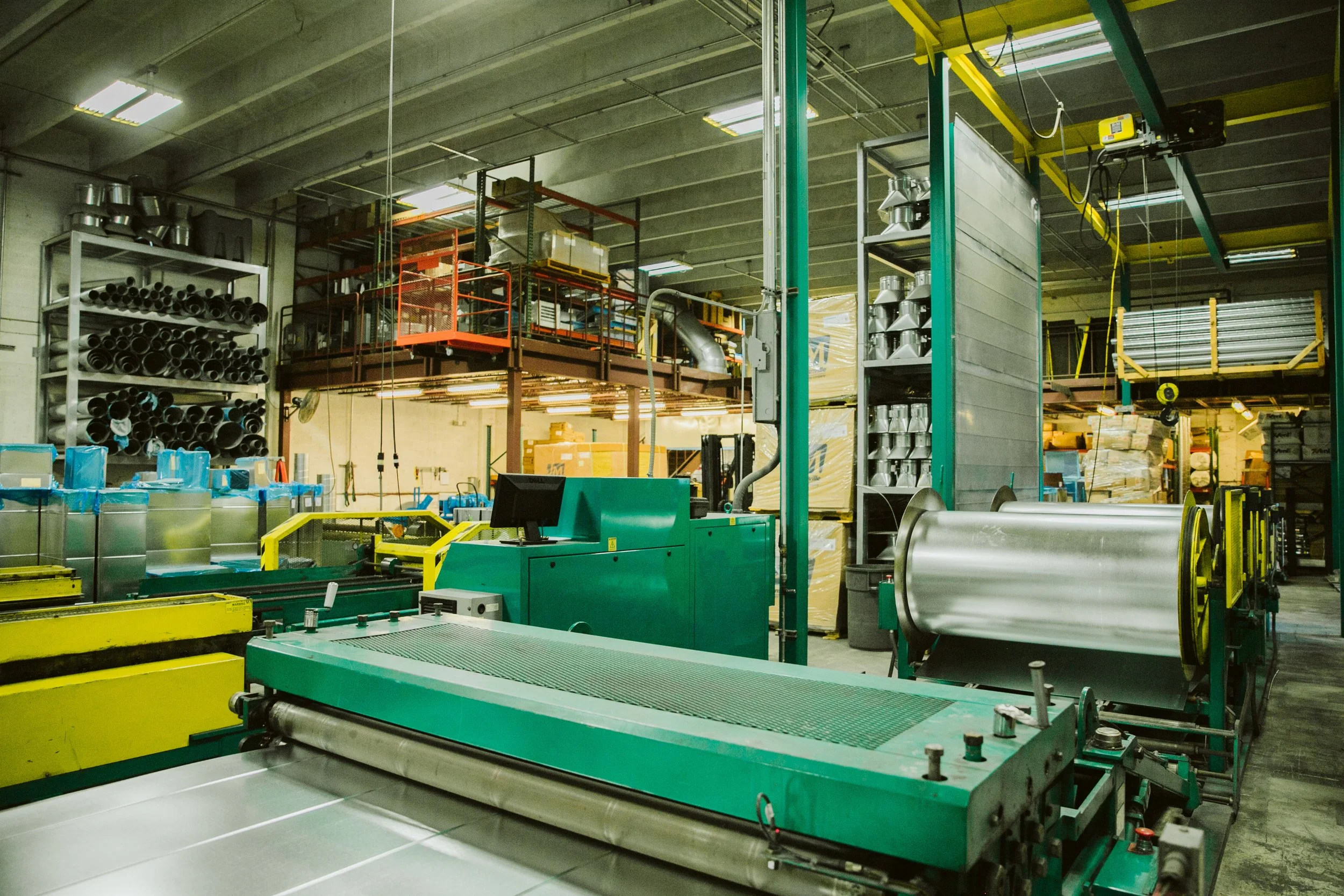 Close-up of skilled worker cutting sheet metal in industrial setting