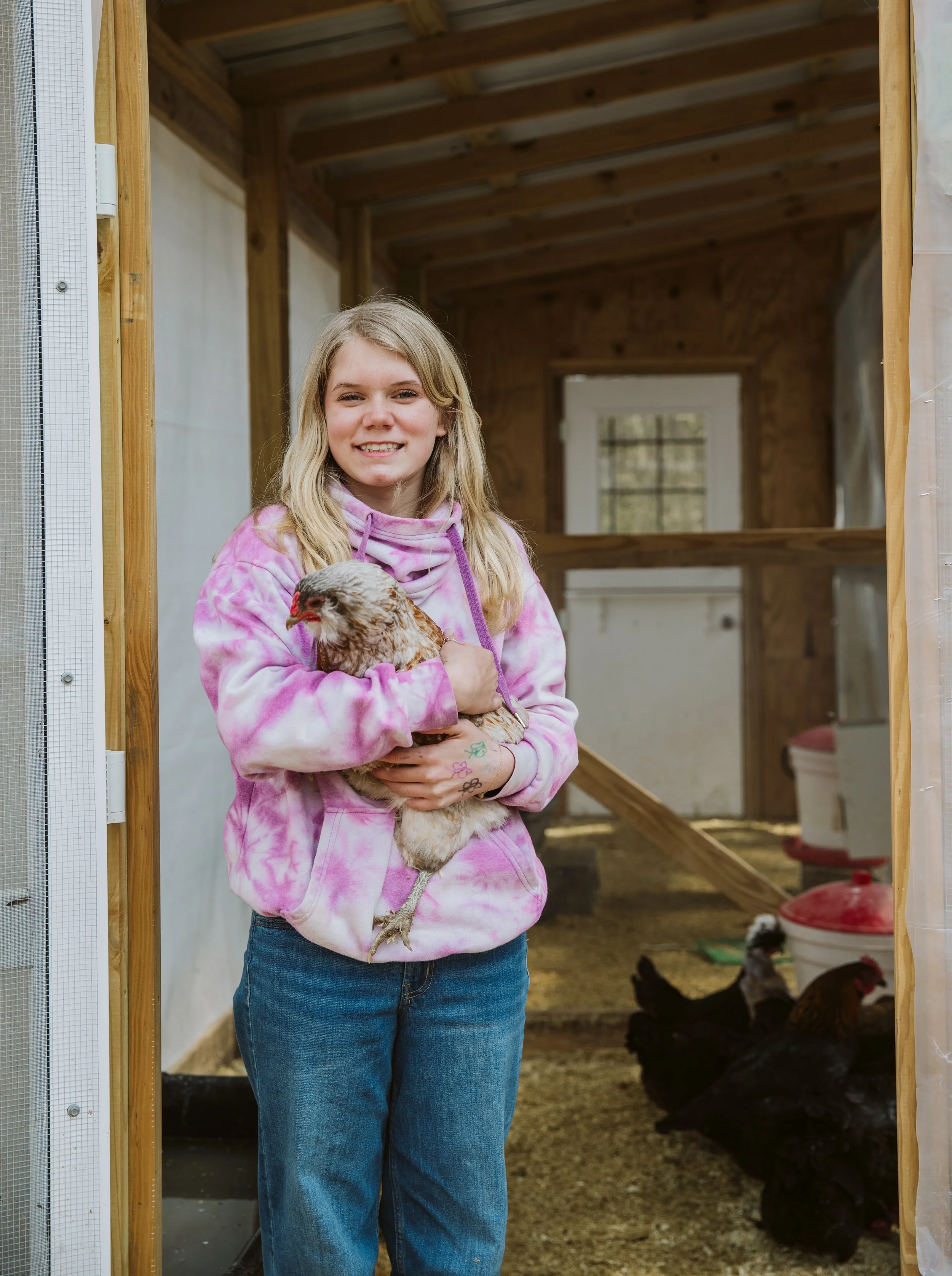 Children learning responsibility through animal care in a homeschool program