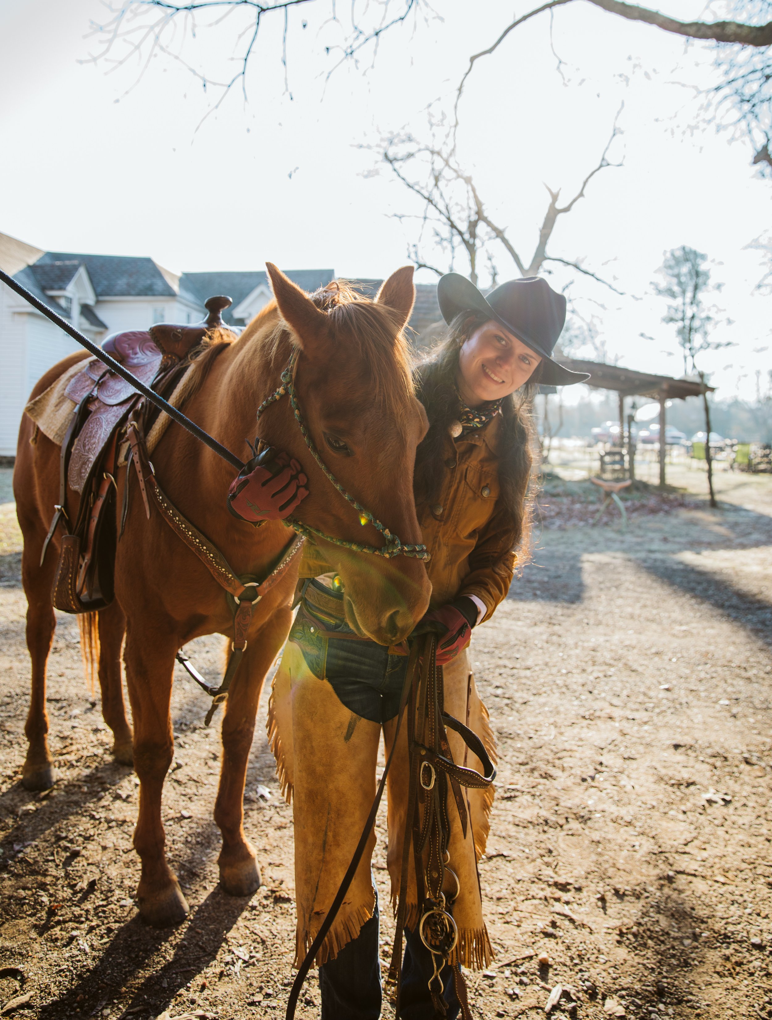 Ranch hand bonding with a horse at a North Georgia ranch