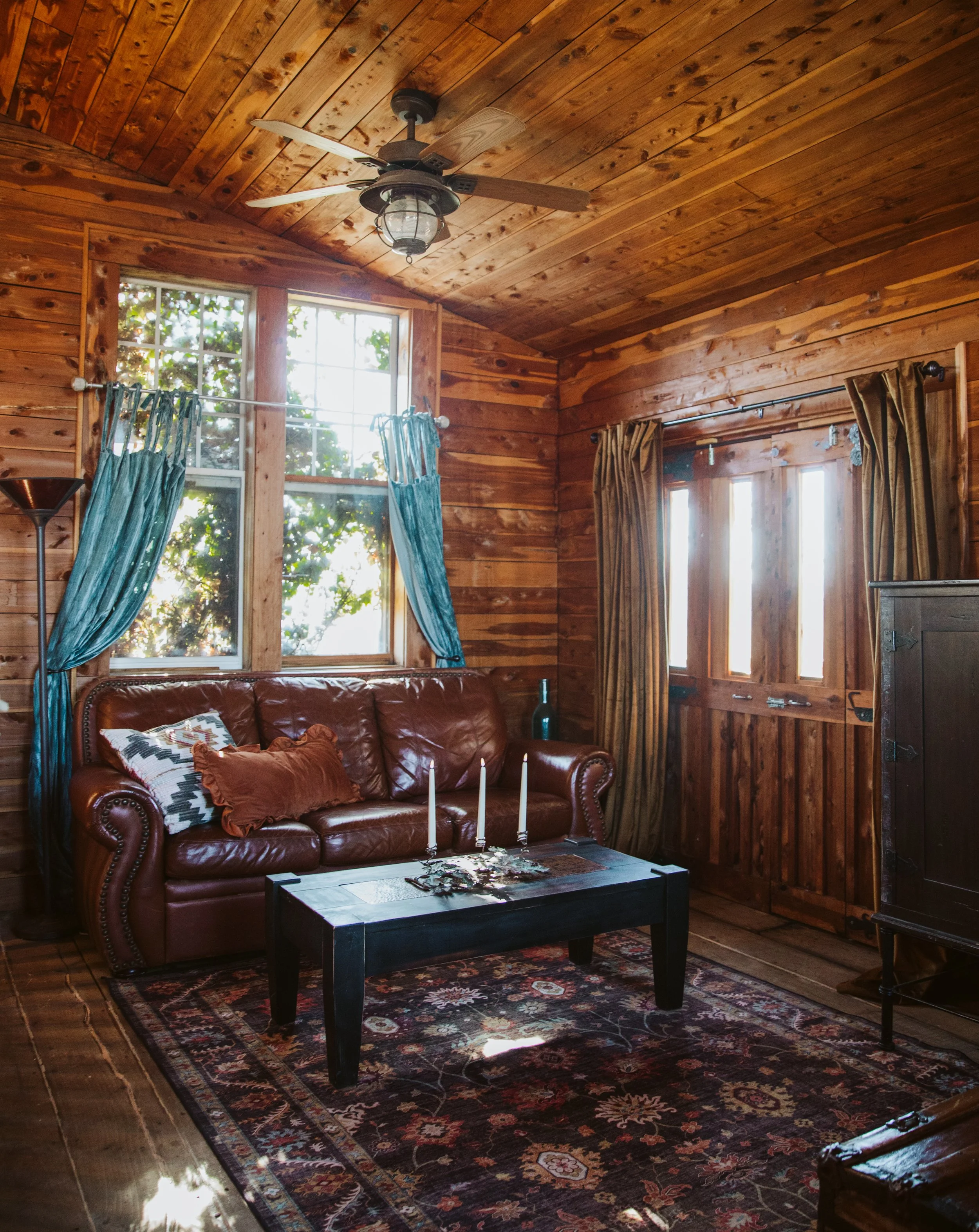 Wood Cabin Living Room with Leather Couch