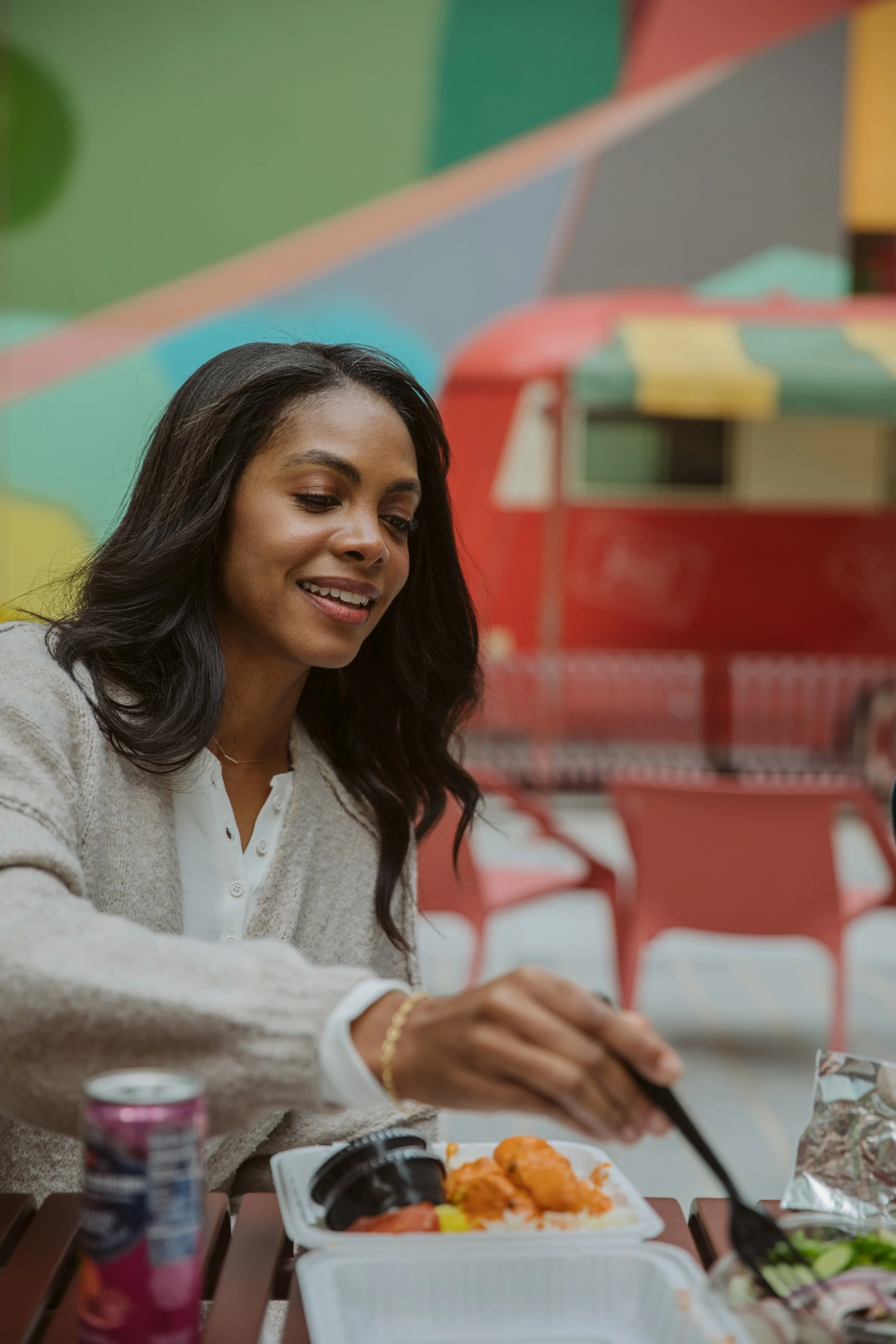 Woman enjoying lunch outdoors at colorful Beltline dining area