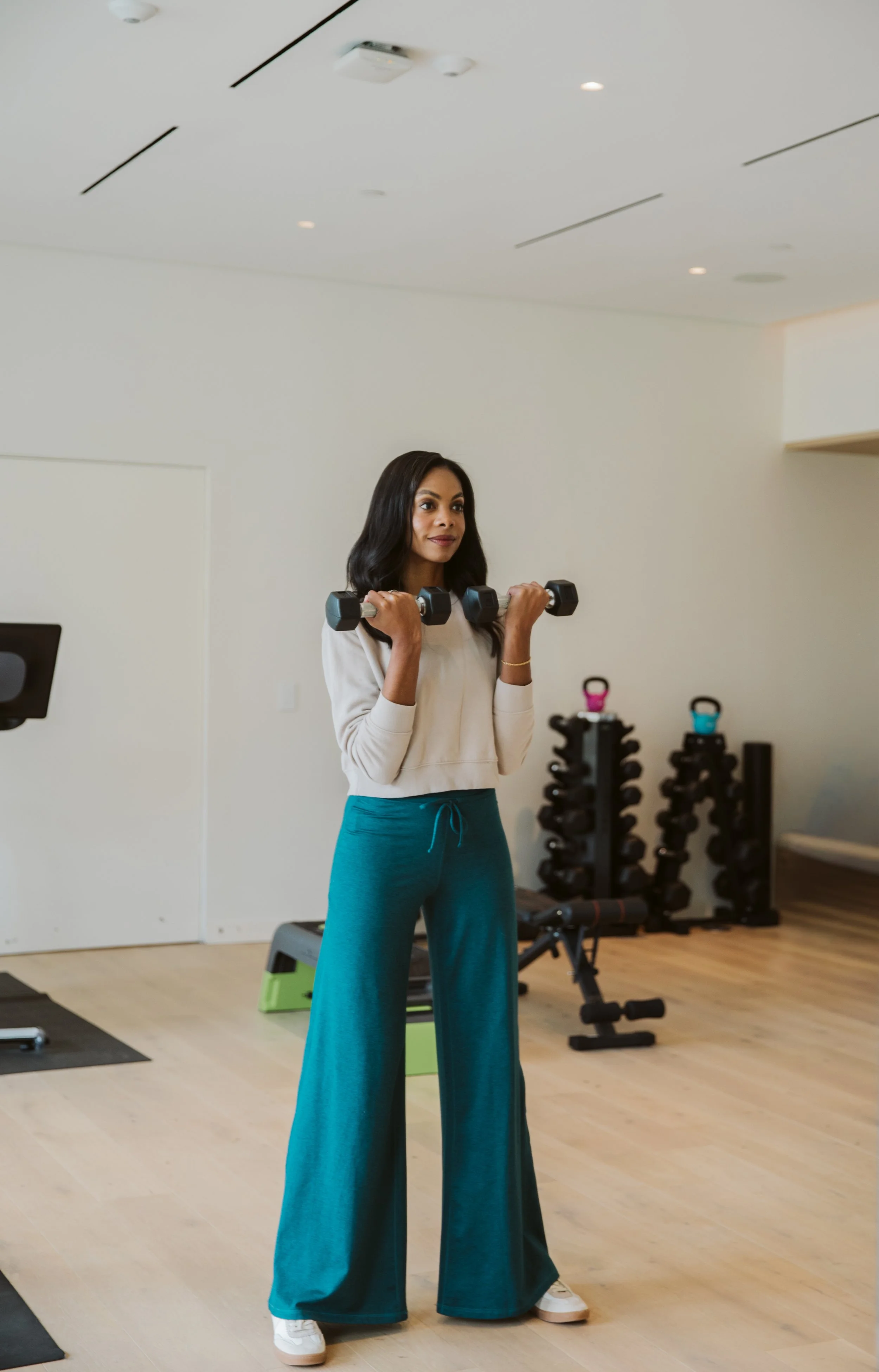 Woman exercising in modern apartment fitness center