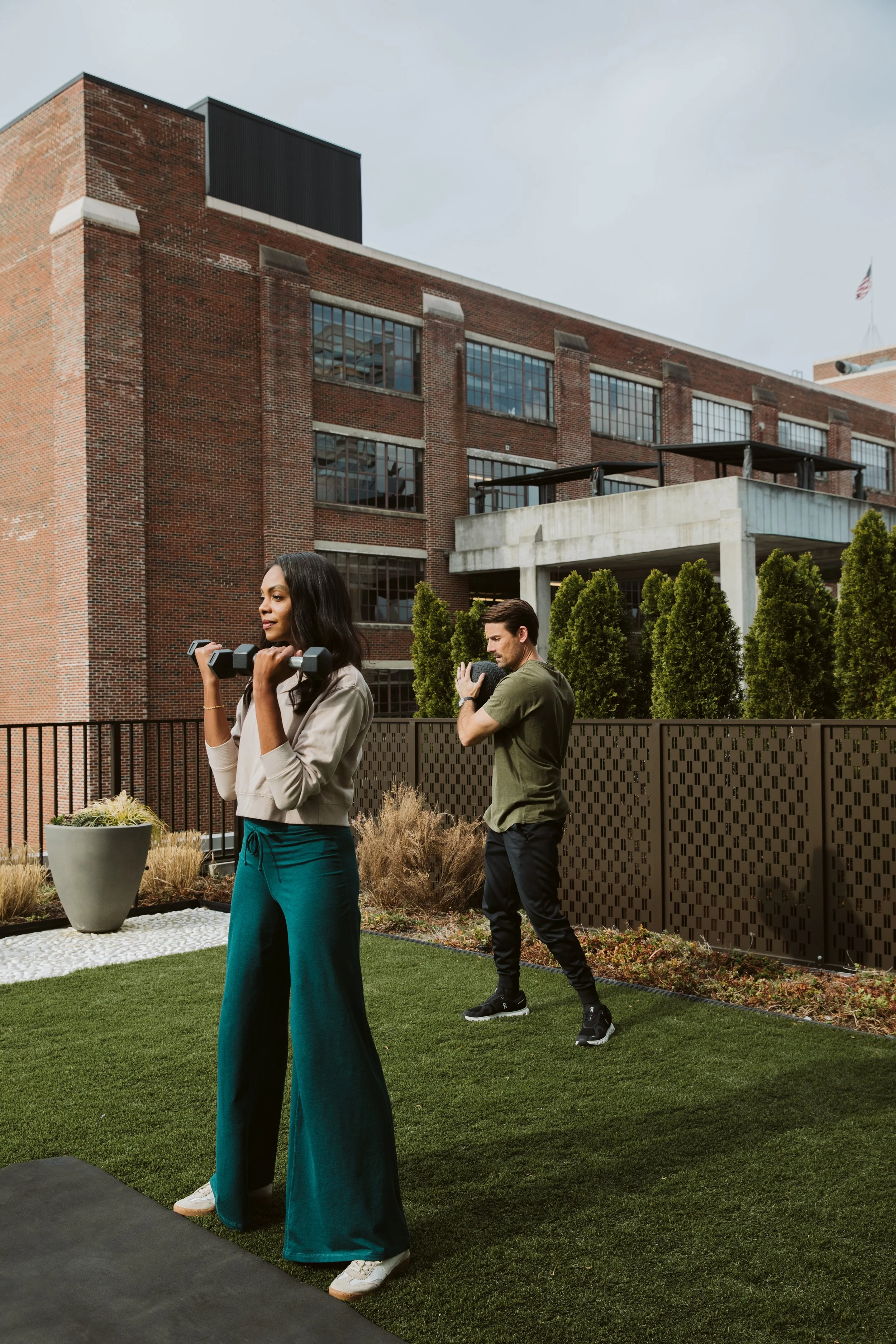 Couple walking near modern Atlanta Beltline apartment community