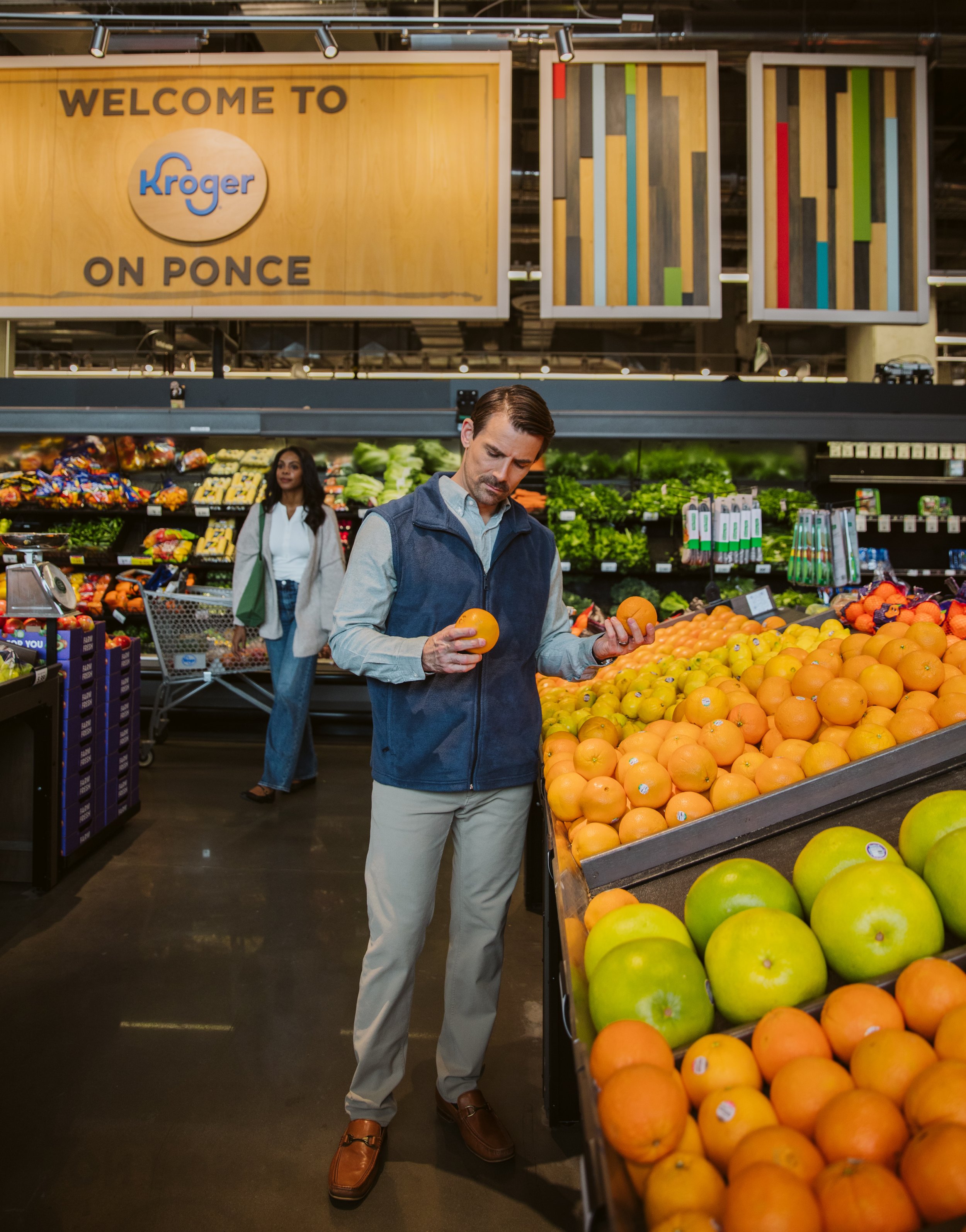 Man grocery shopping in Kroger produce section near Beltline