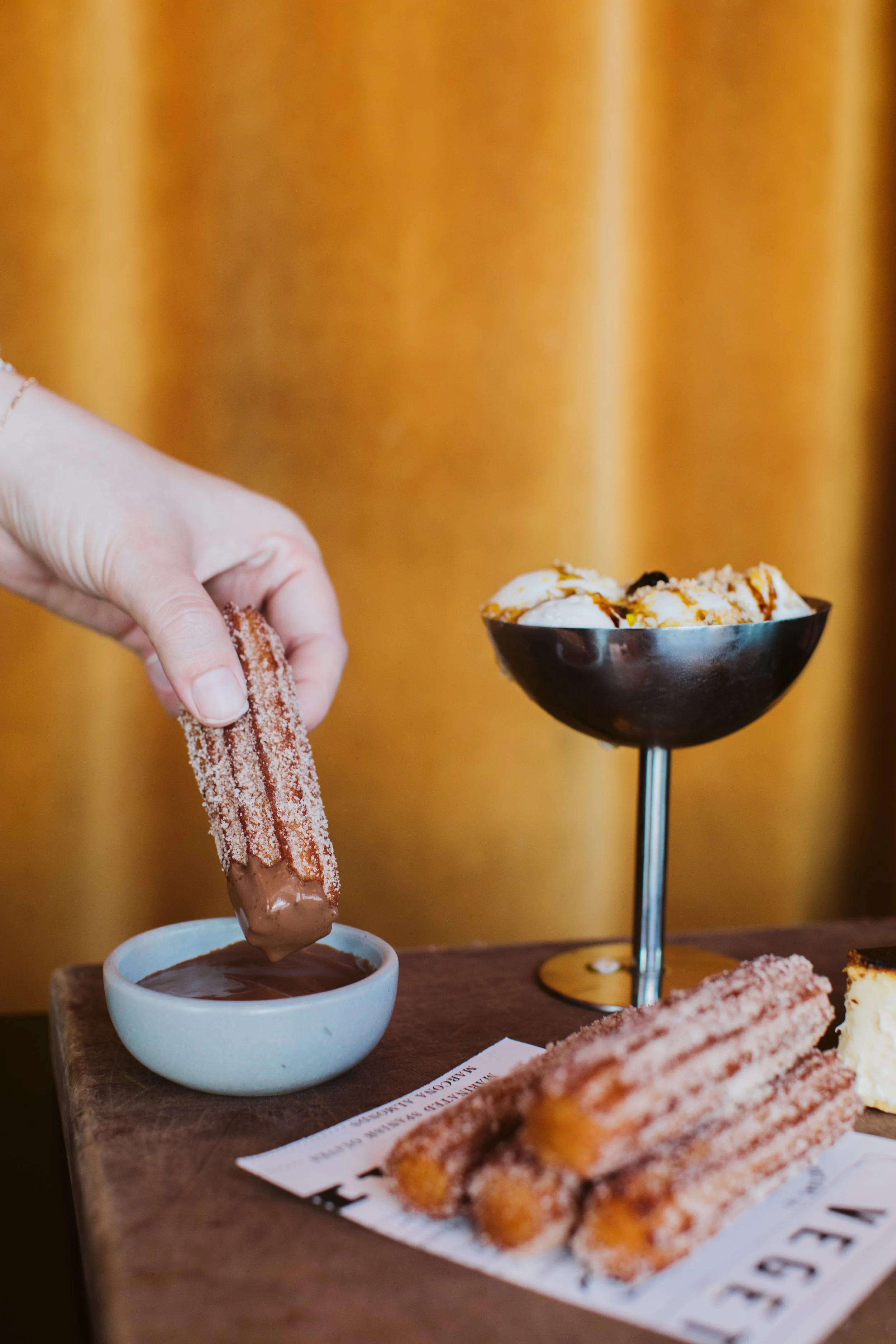 Dessert churros dipped in chocolate sauce