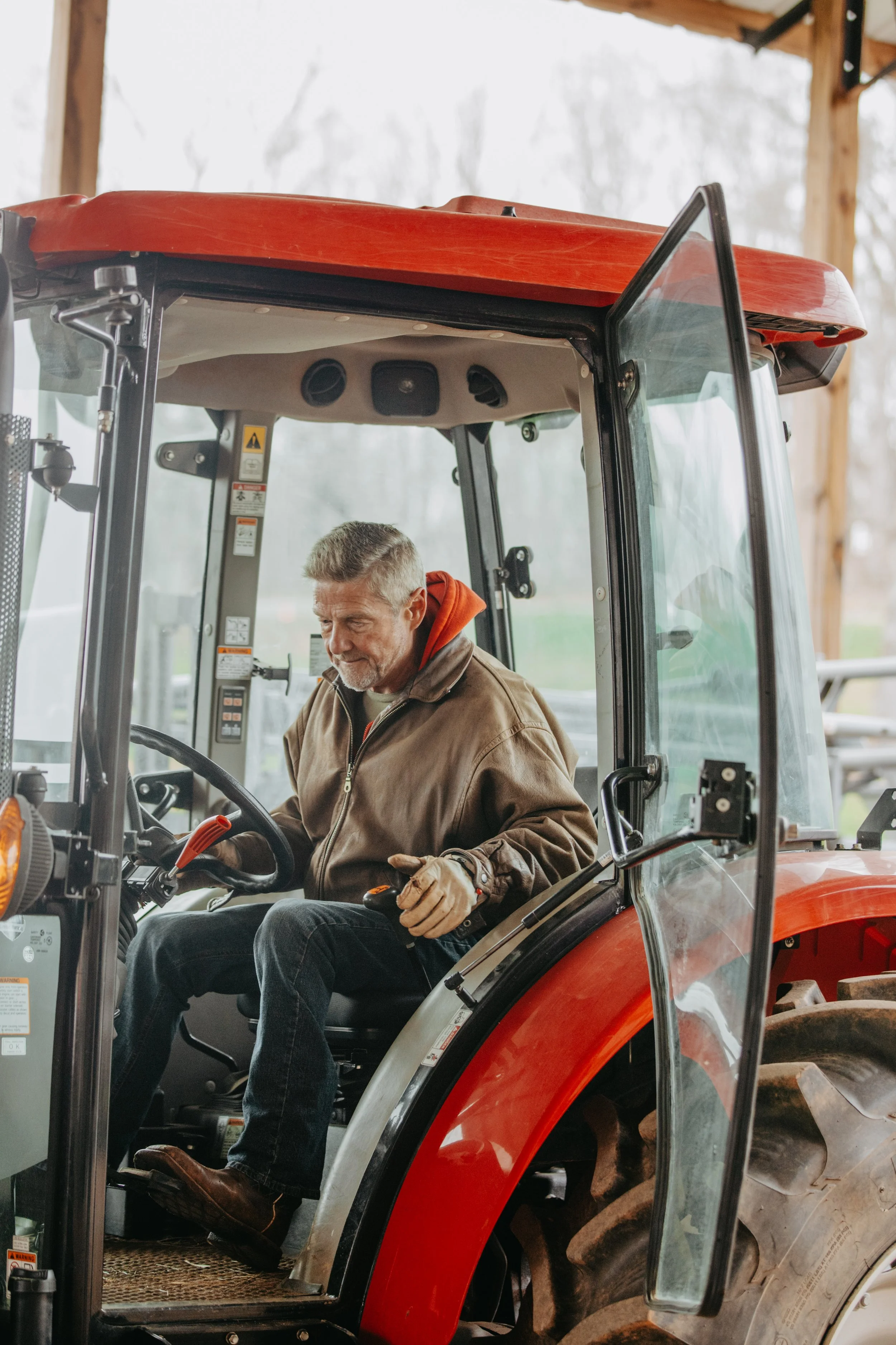 Farmer driving tractor