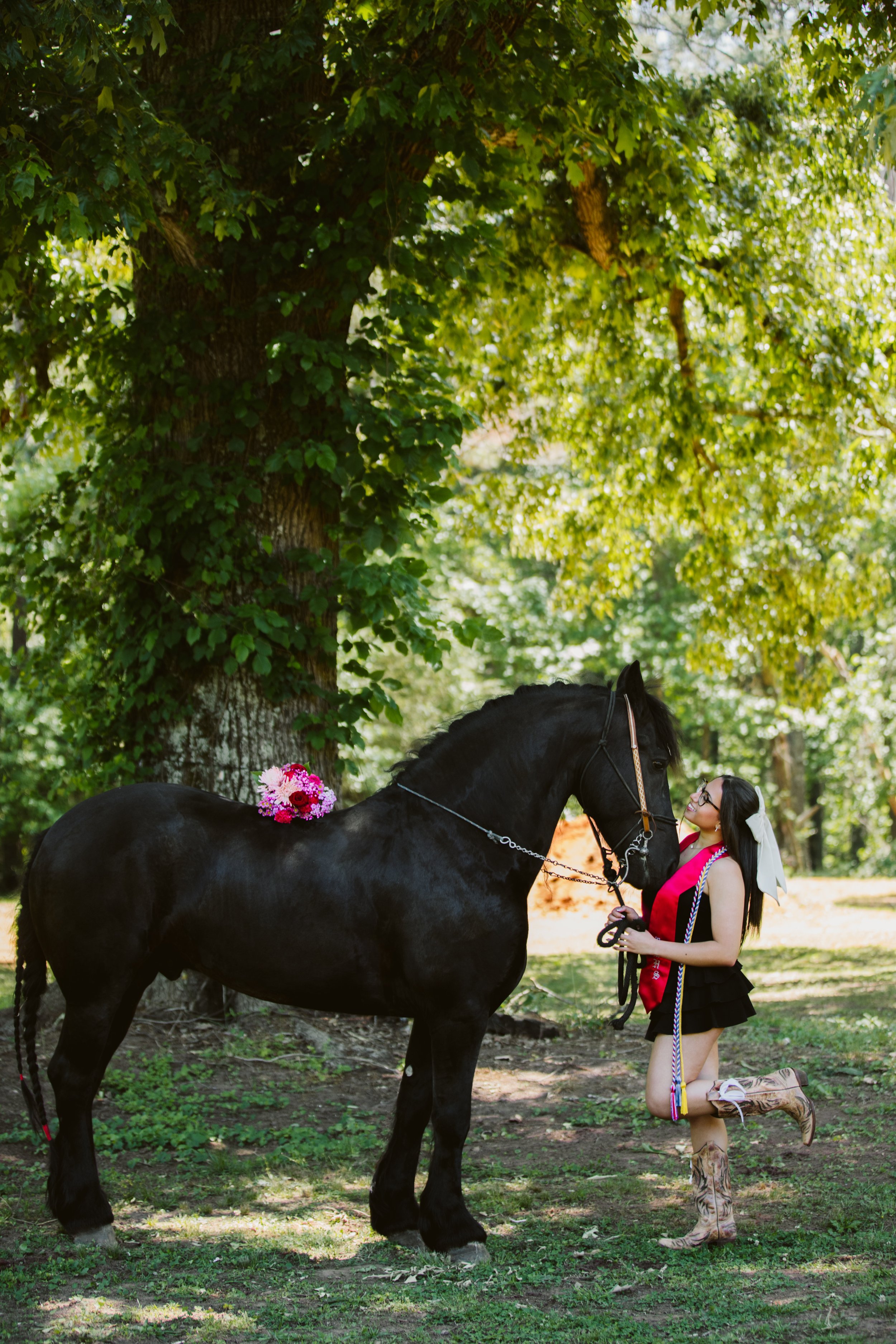 Senior girl and horse under trees in Georgia