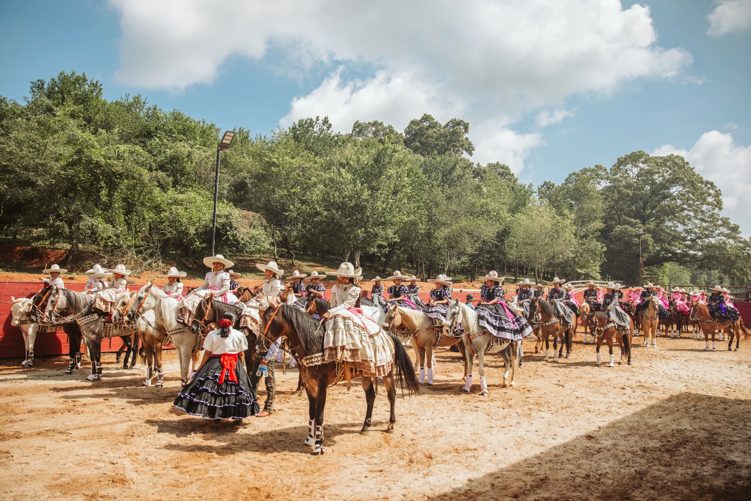 Escaramuza riders preparing for performance