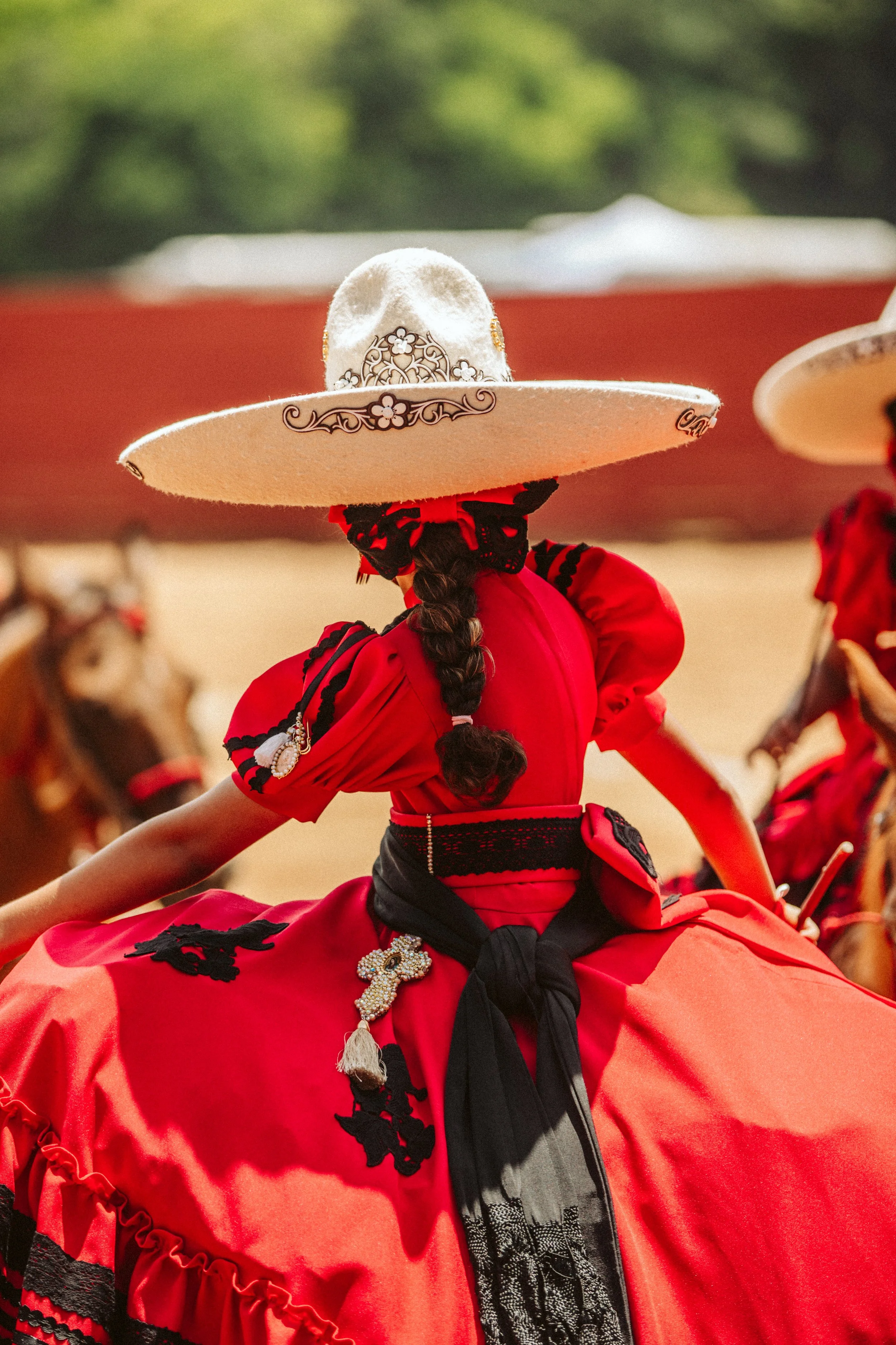 Escaramuza rider in red dress