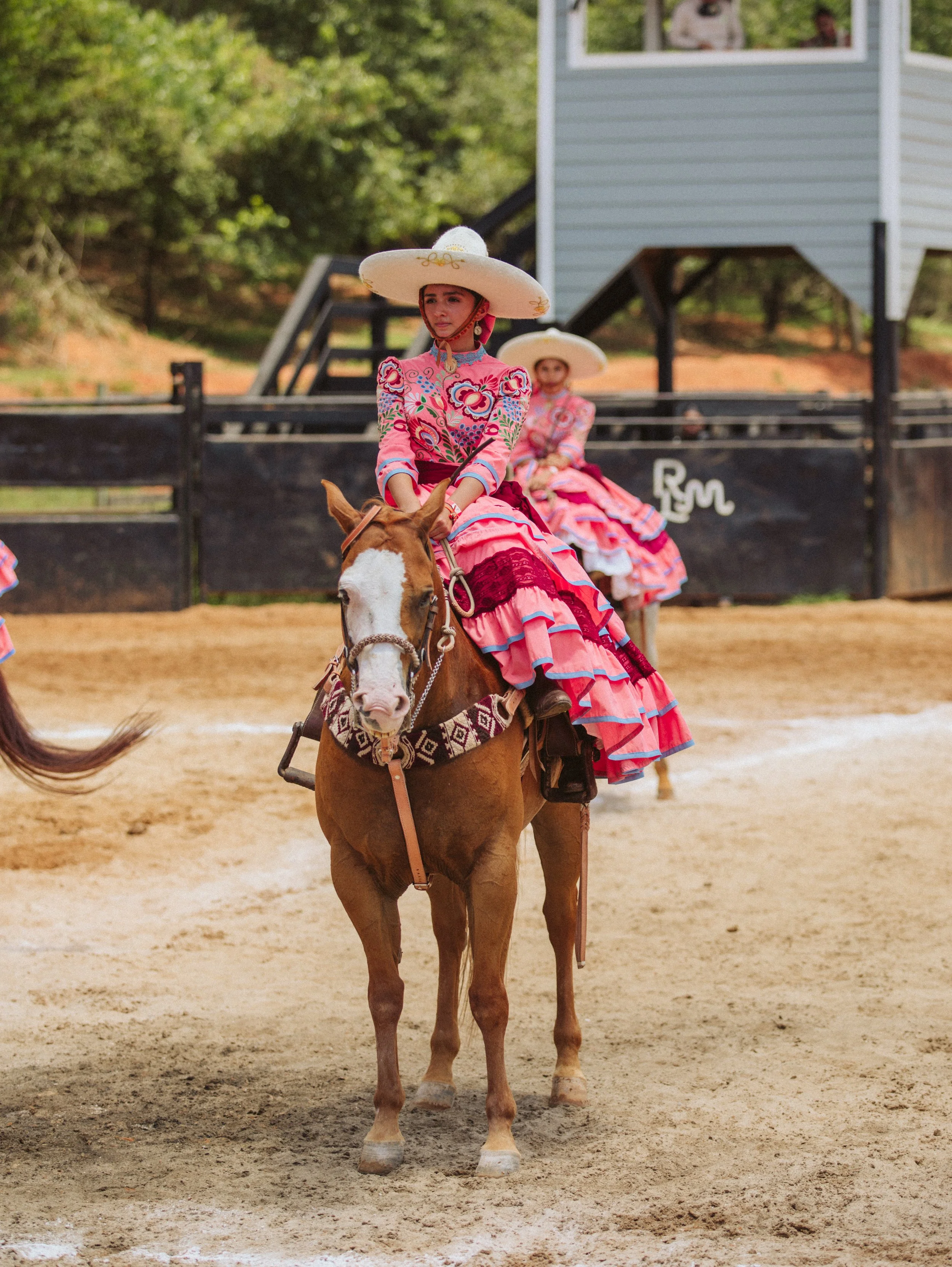 Escaramuza rider in pink dress
