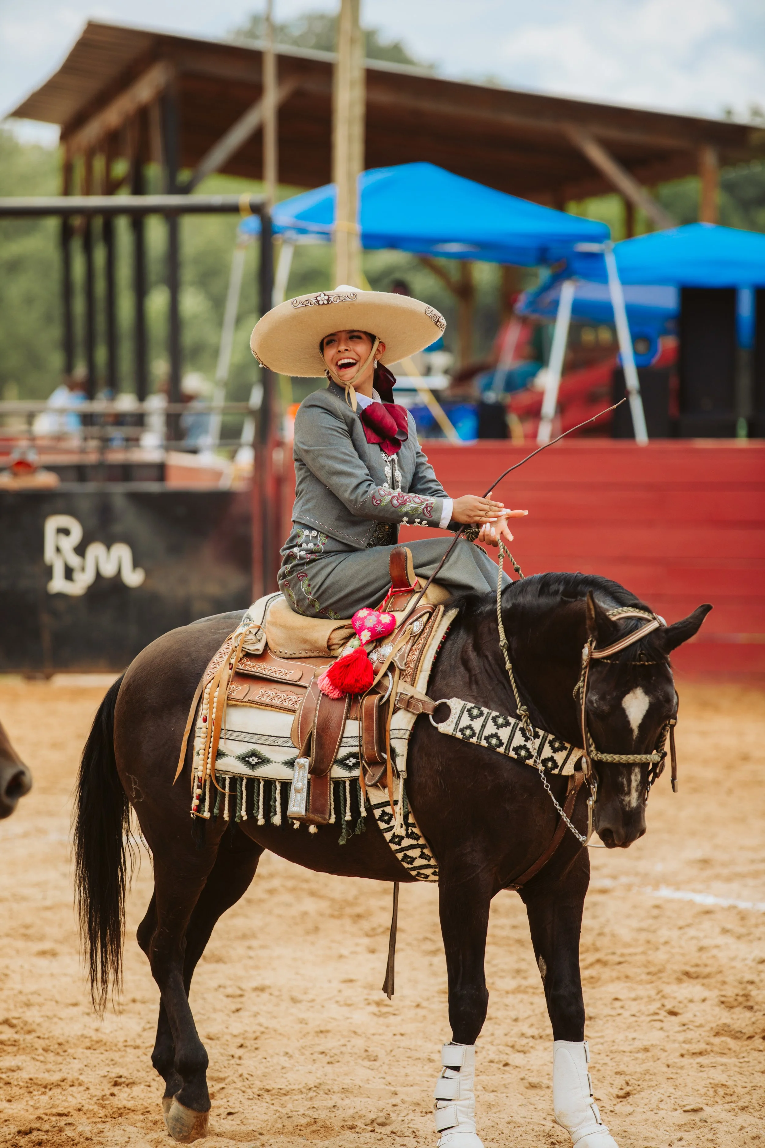 Escaramuza rider on black horse
