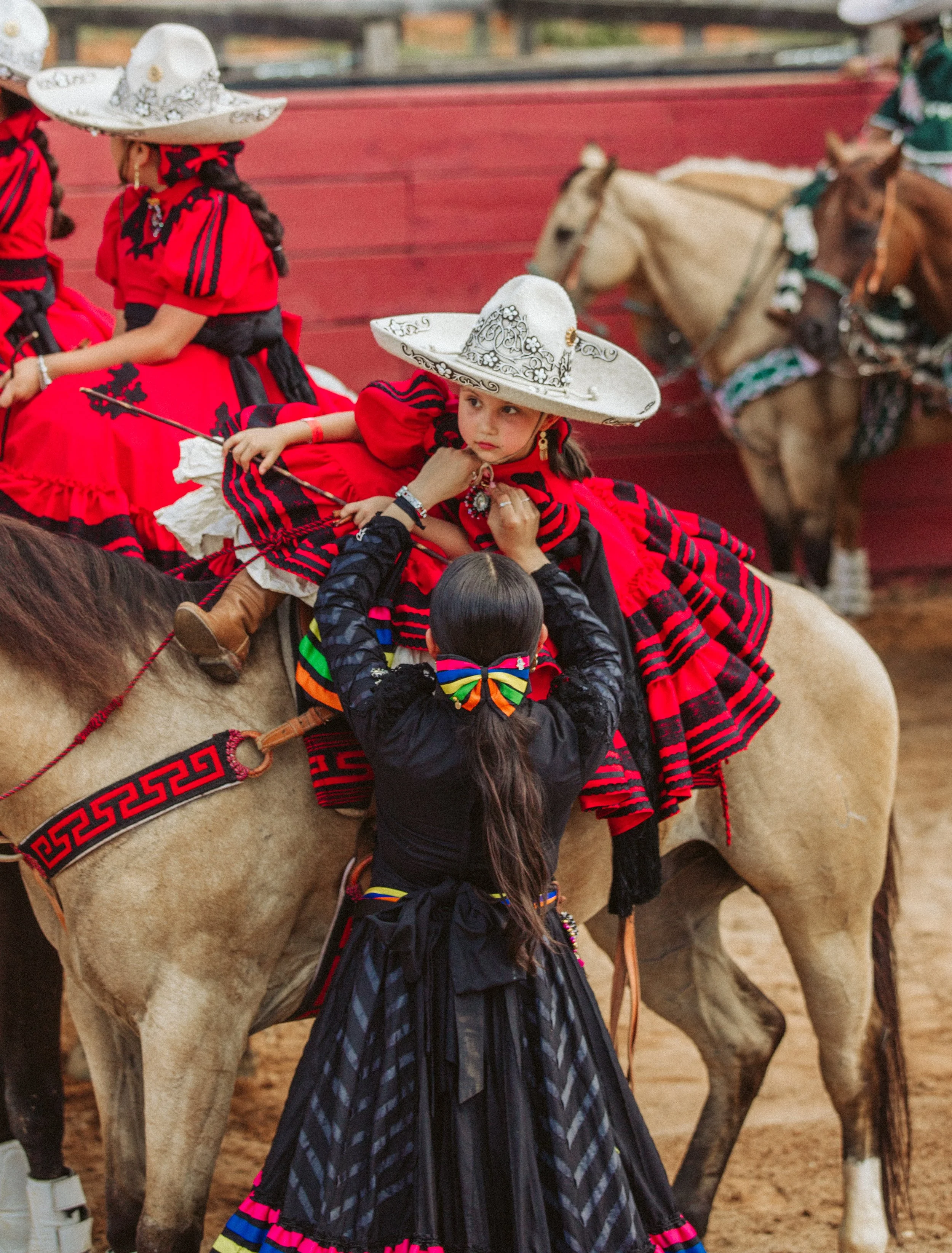 Escaramuza team preparing horses