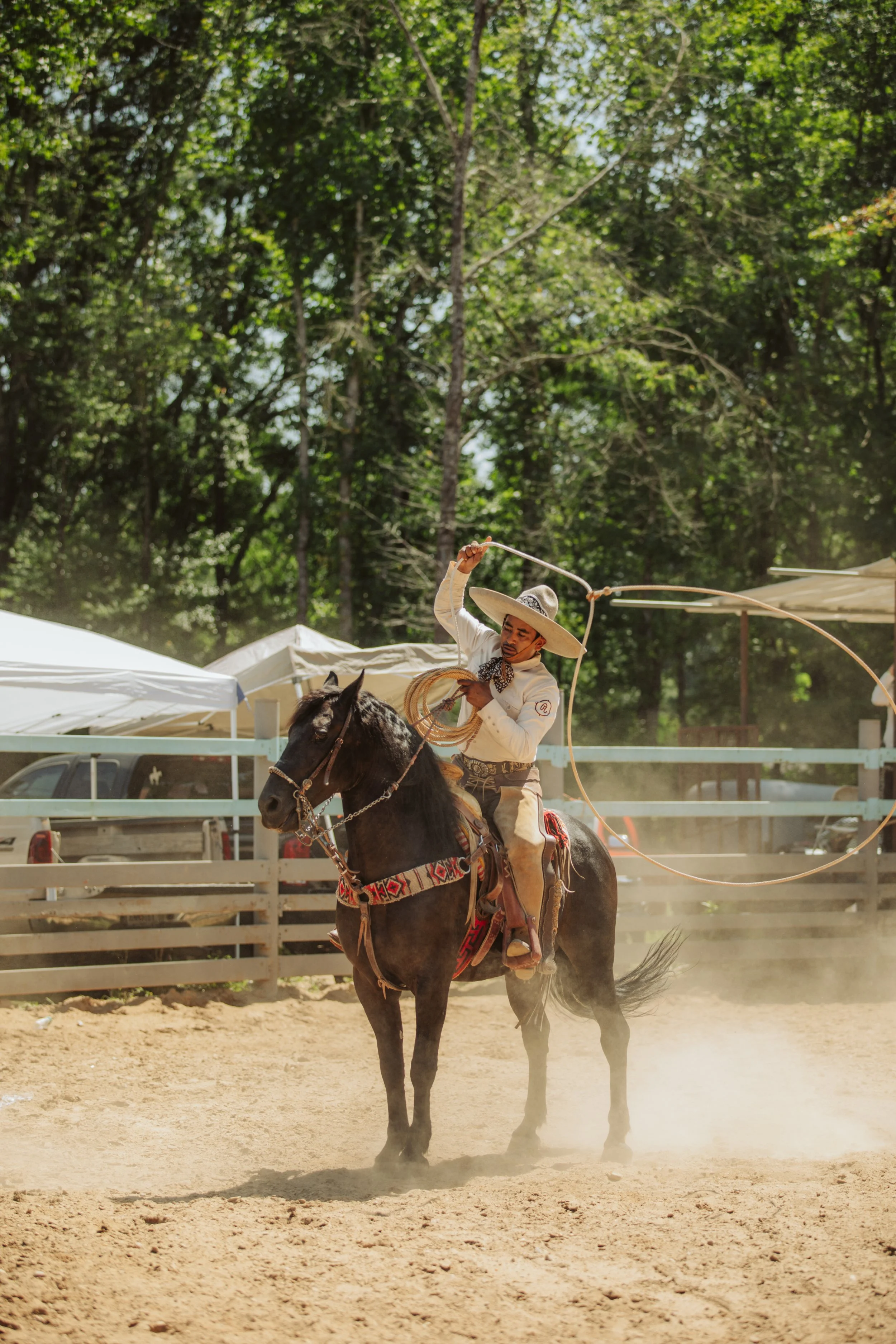 Charro Riding Through the Dust
