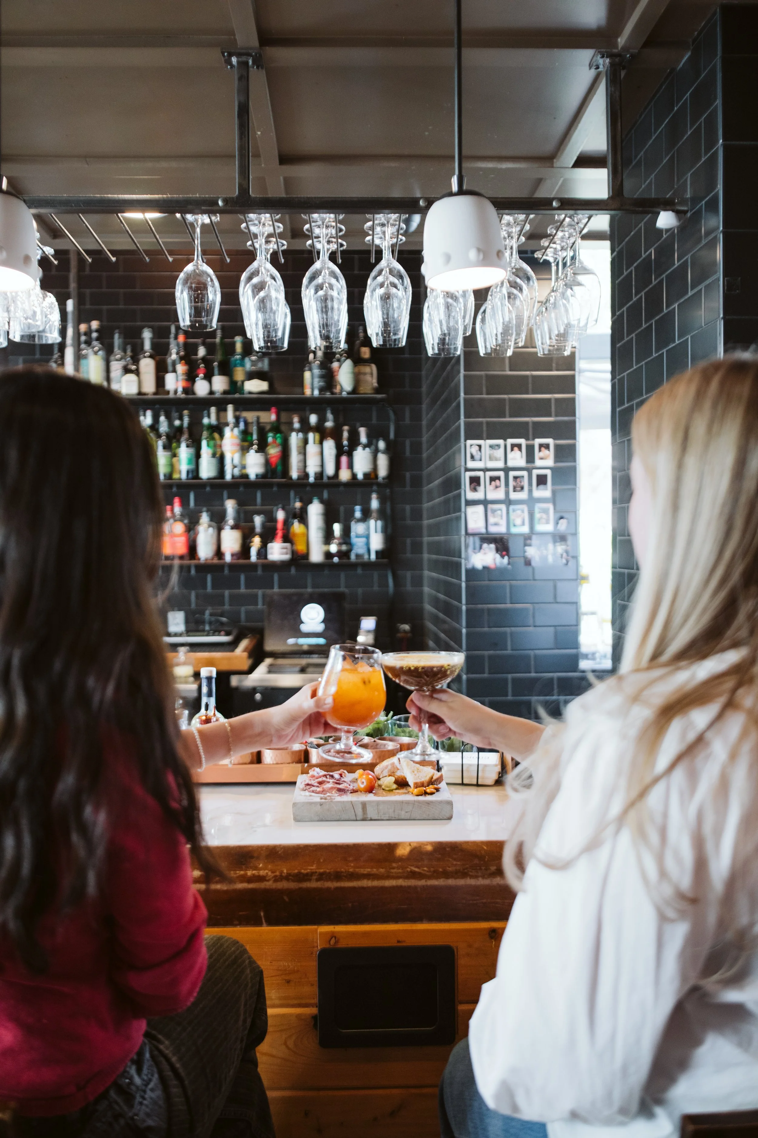 Editorial beverage photography featuring a styled cocktail and plated dish in a modern Atlanta restaurant.