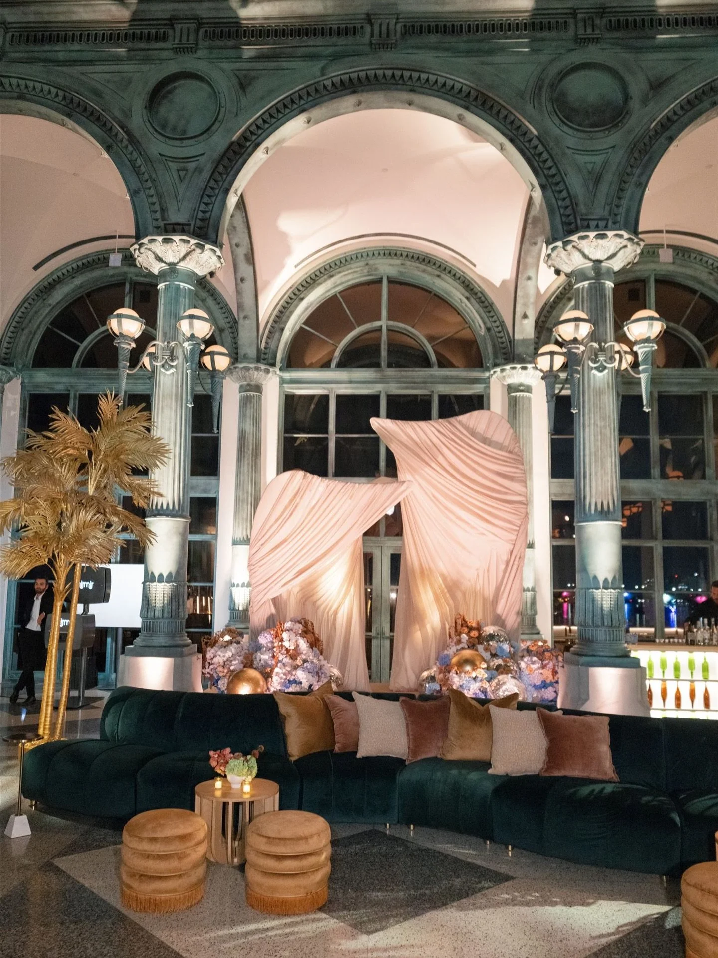 After dark, the ceremony space was transformed into Emma &amp; Will&rsquo;s nightclub ✨. Disco balls nested into the florals, and the ceremony became a must-have photo moment. Hunter green velvet, glowing gold palms, and a custom-built bar set the st