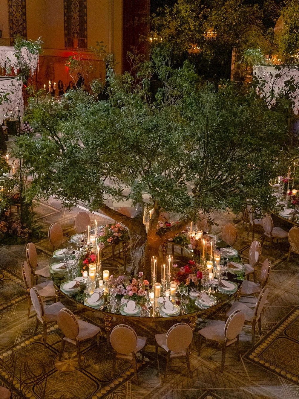 As trees sprouted, creating their own forest, an abstract canopy of leaves swept above mirror-top oval tables where flowers bloomed in between.

An evening as majestic as the setting itself. We&rsquo;ll never be over this one 🤍

Event Planning, Desi