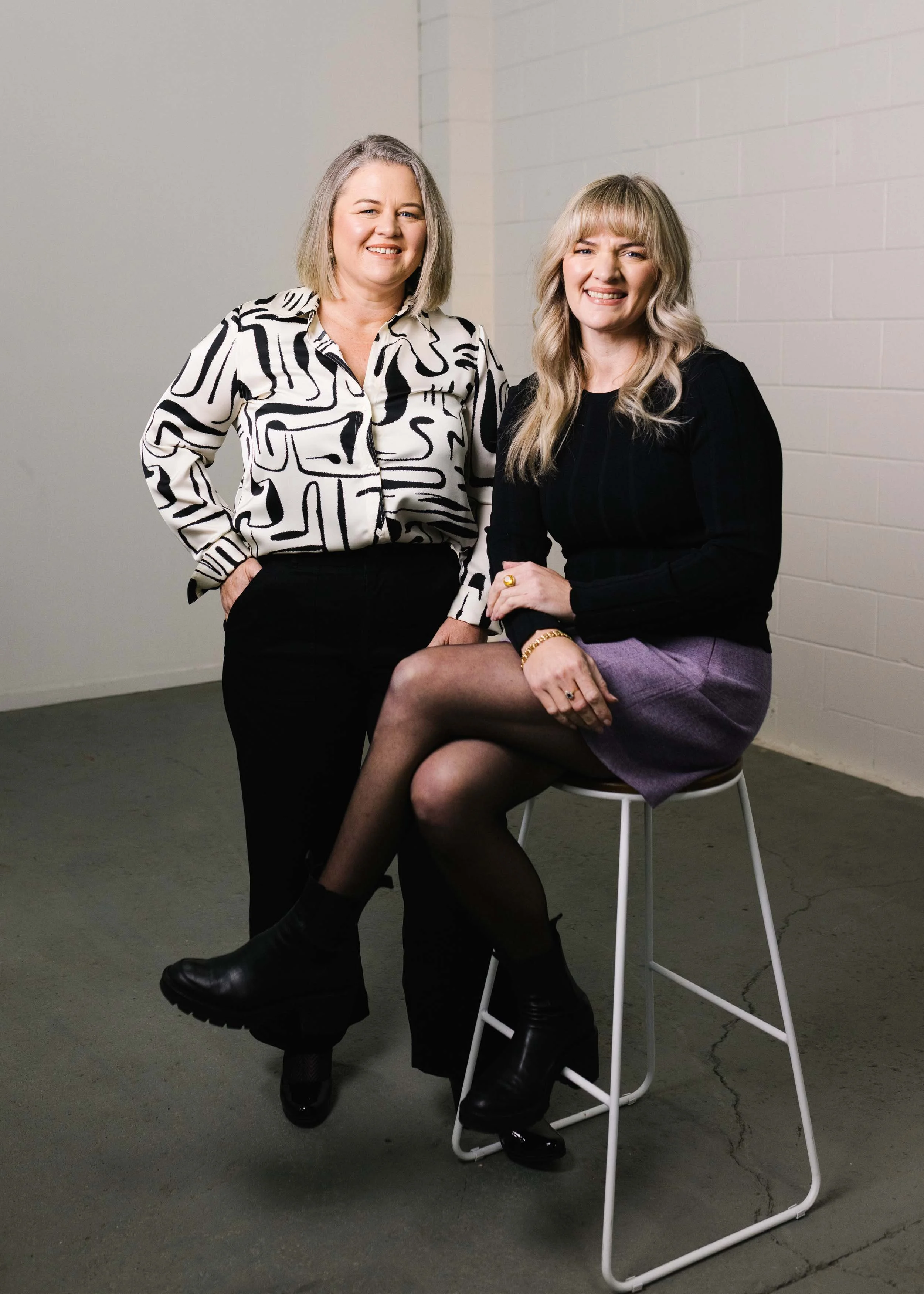 Portrait of Alanah Eagle and Theresa Eagle a business broker and sister duo