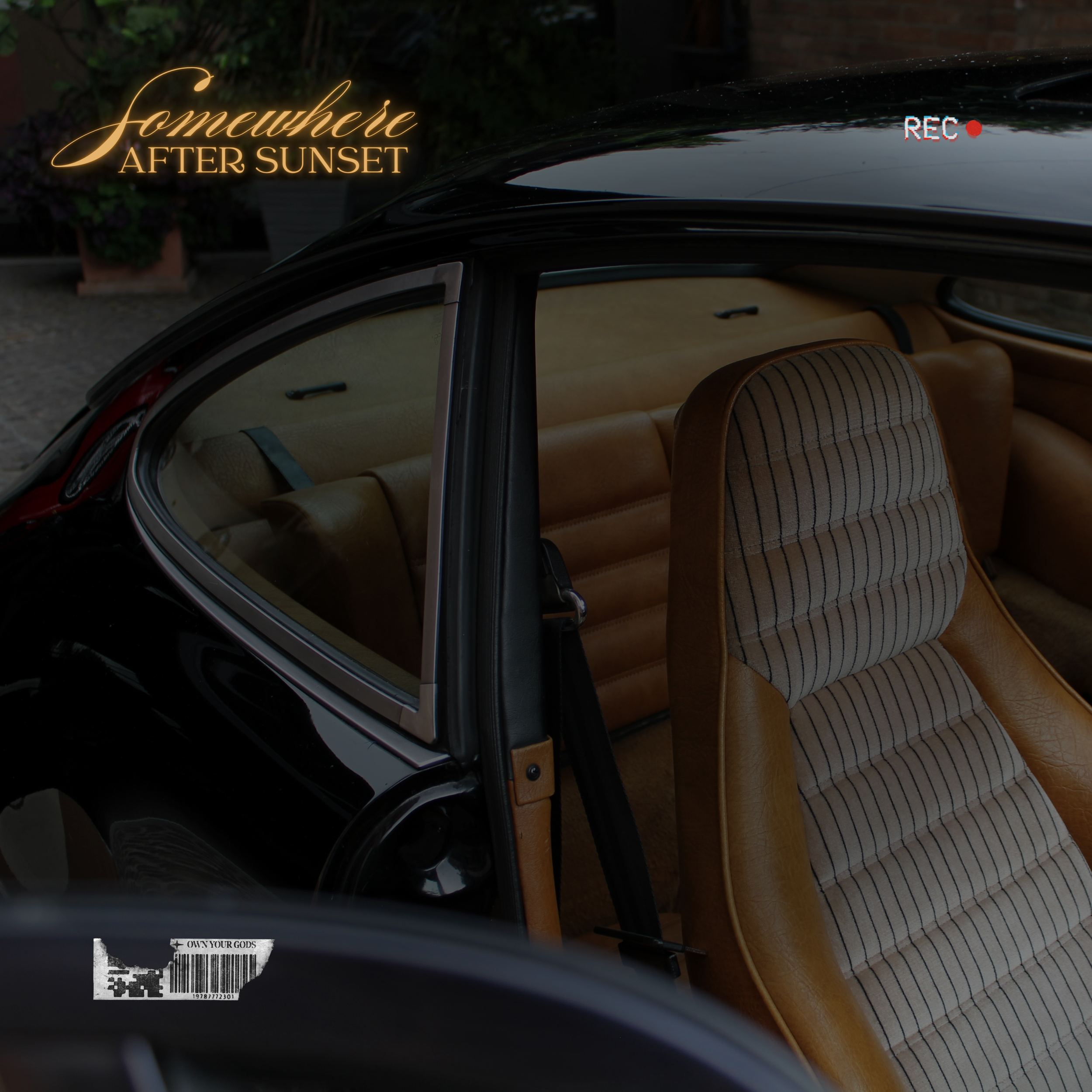 Interior of a vintage black car with tan seats and striped upholstery, with text overlay 'Somewhere After Sunset' and a 'REC' icon in the upper right corner.