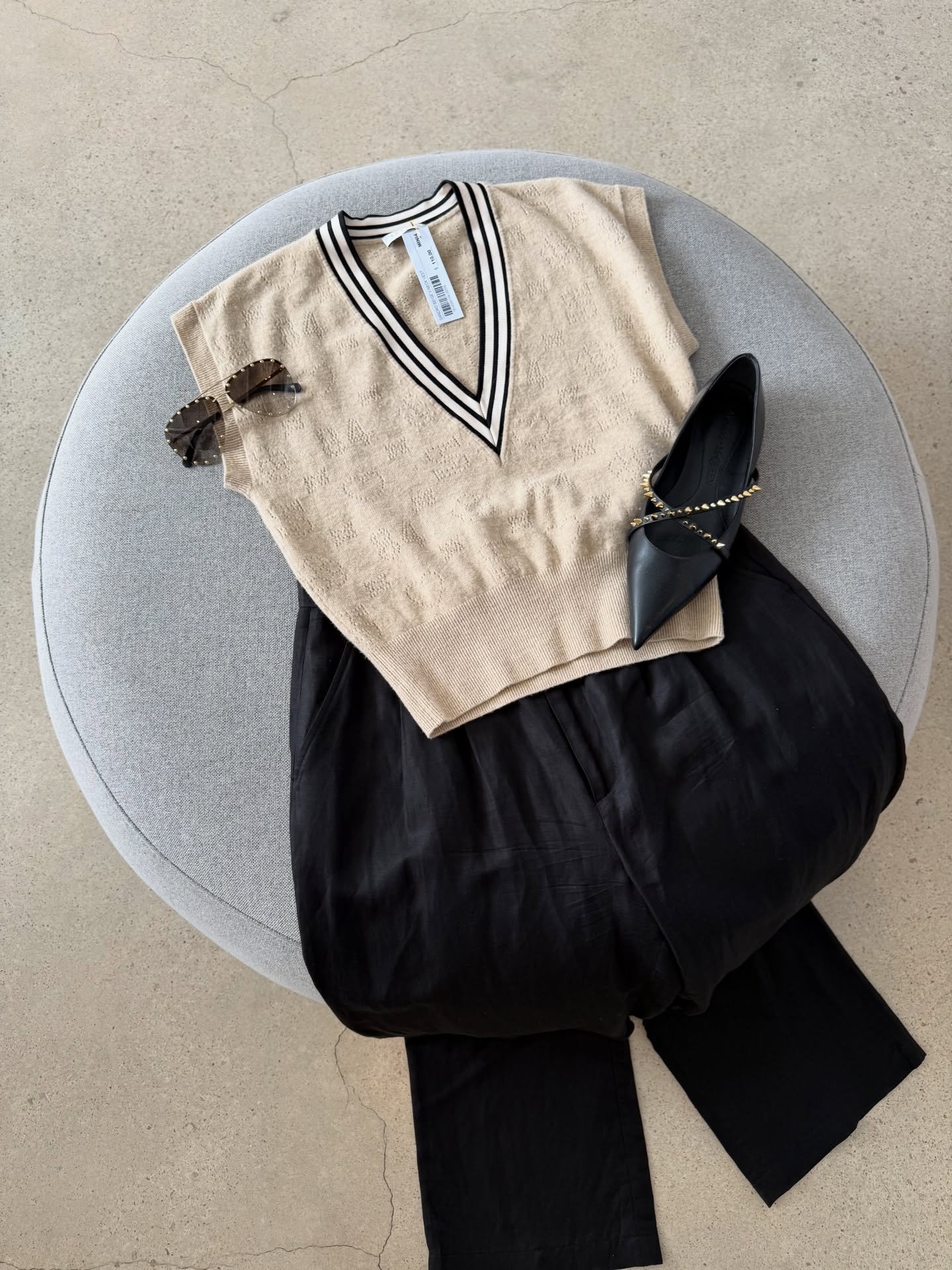 Carefully chosen. Beautifully laid out 💕

Image 1:
Sandro beige V-neck vest - $110
Anine Bing black trousers - size 40 - $60
Alexander McQueen black sandals - size 40 - $400

Image 2: Scanlan Theodore beige tank - size XS - $30
Faithful the Label sk