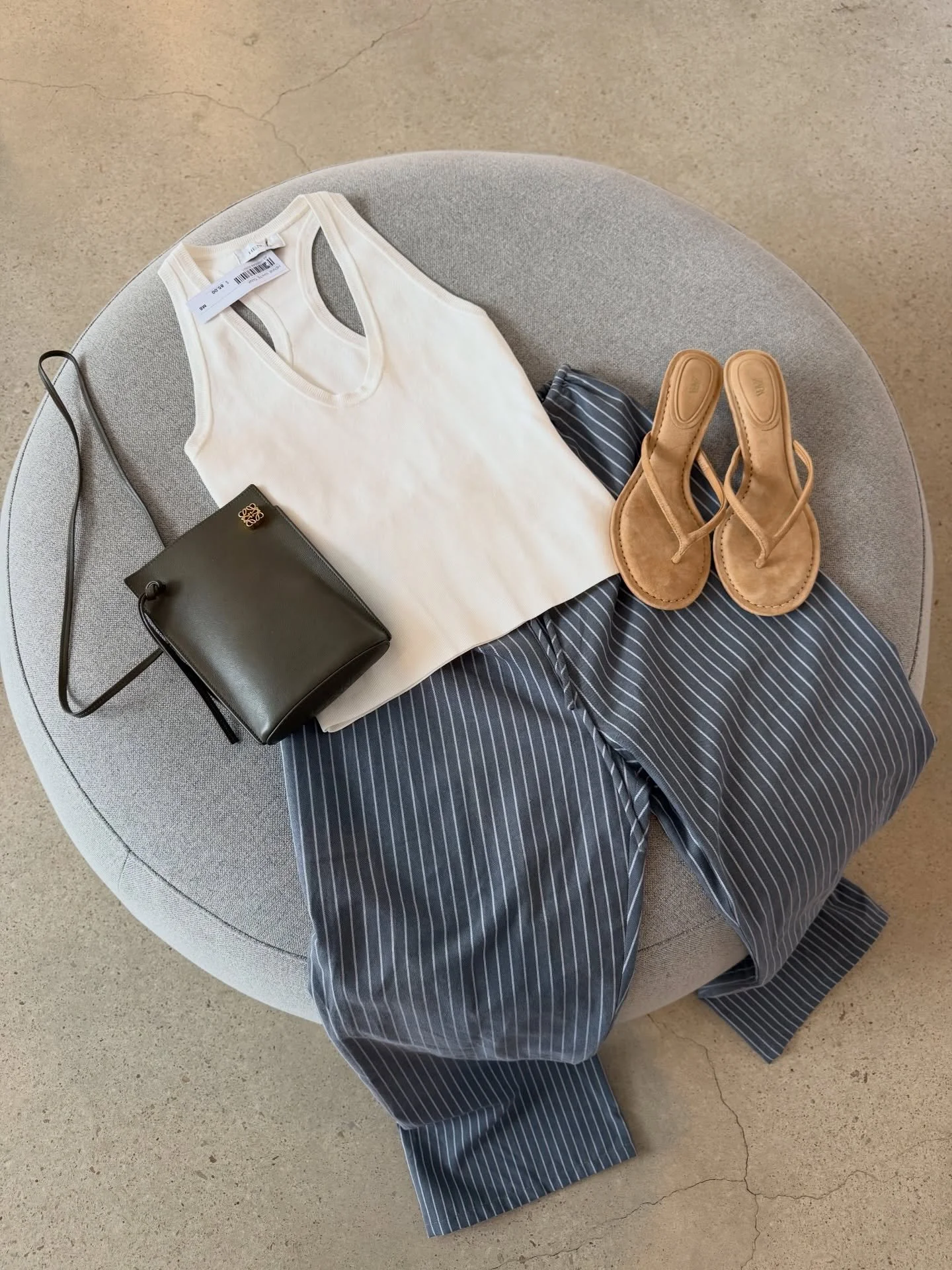 Pieces that work even better together 🛍️💕

Image 1:
Henne white tank - size S - $85 SOLD
Dissh grey pants - size 6 - $50
Loewe phone bag - $950
Zara suede thong heels - size 38 - $70

Image 2: Henne brown tank - size XS - $90 SOLD
Henne white mini 