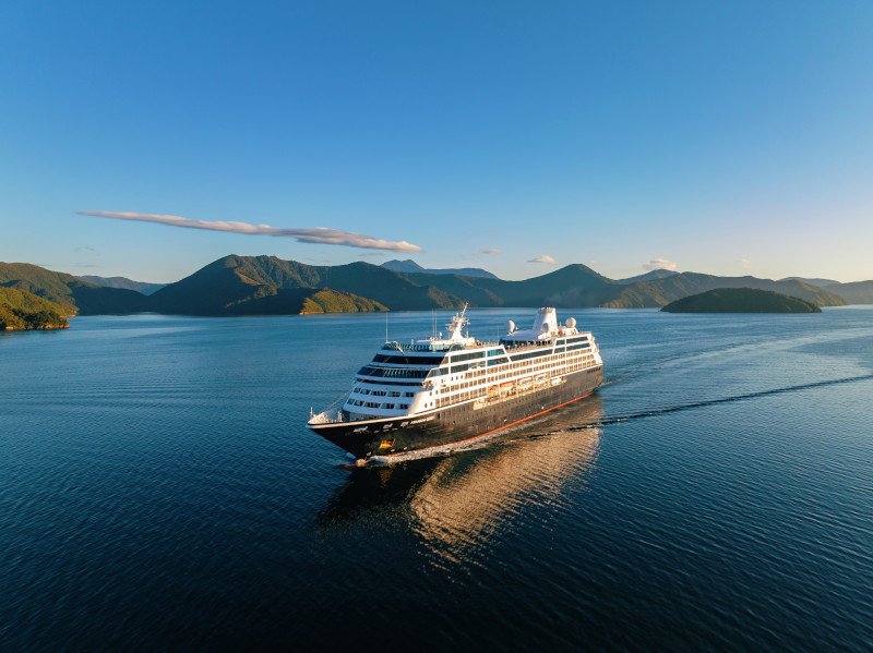 Azamara Cruises:
Smaller ships. Longer stays. Big on culture.
Azamara trades waterslides for wanderlust, sailing into ports the big guys skip. It’s more boutique hotel, less theme park.