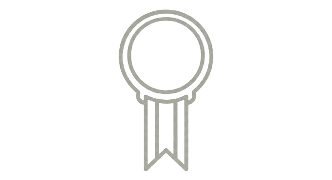 Illustration of a medal or award ribbon with a circular top and two hanging tails.