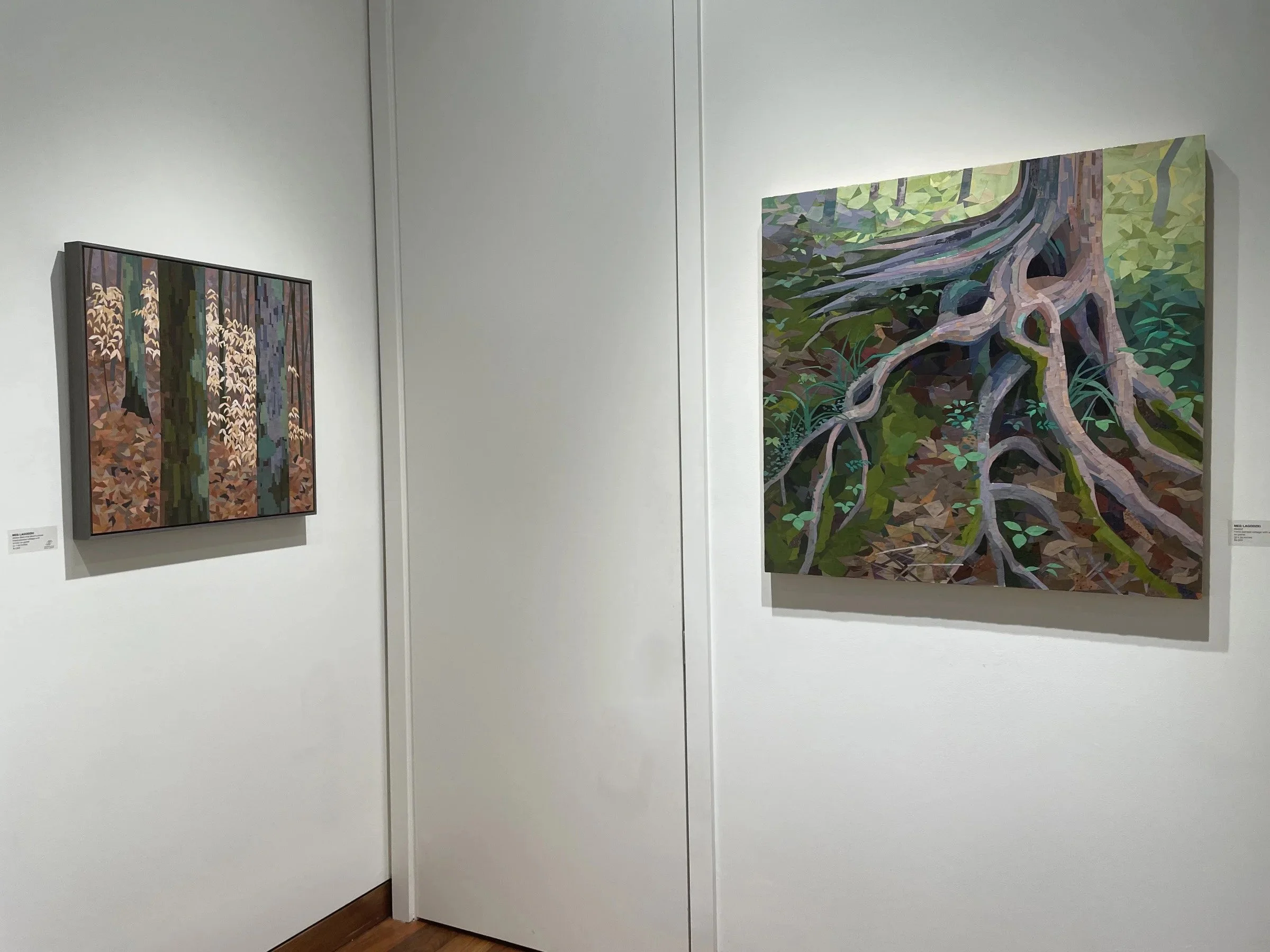 Two landscape paintings in a gallery, one on the left showing trees in a forest with subdued colors, and one on the right depicting tree roots in a vibrant, stylized manner.